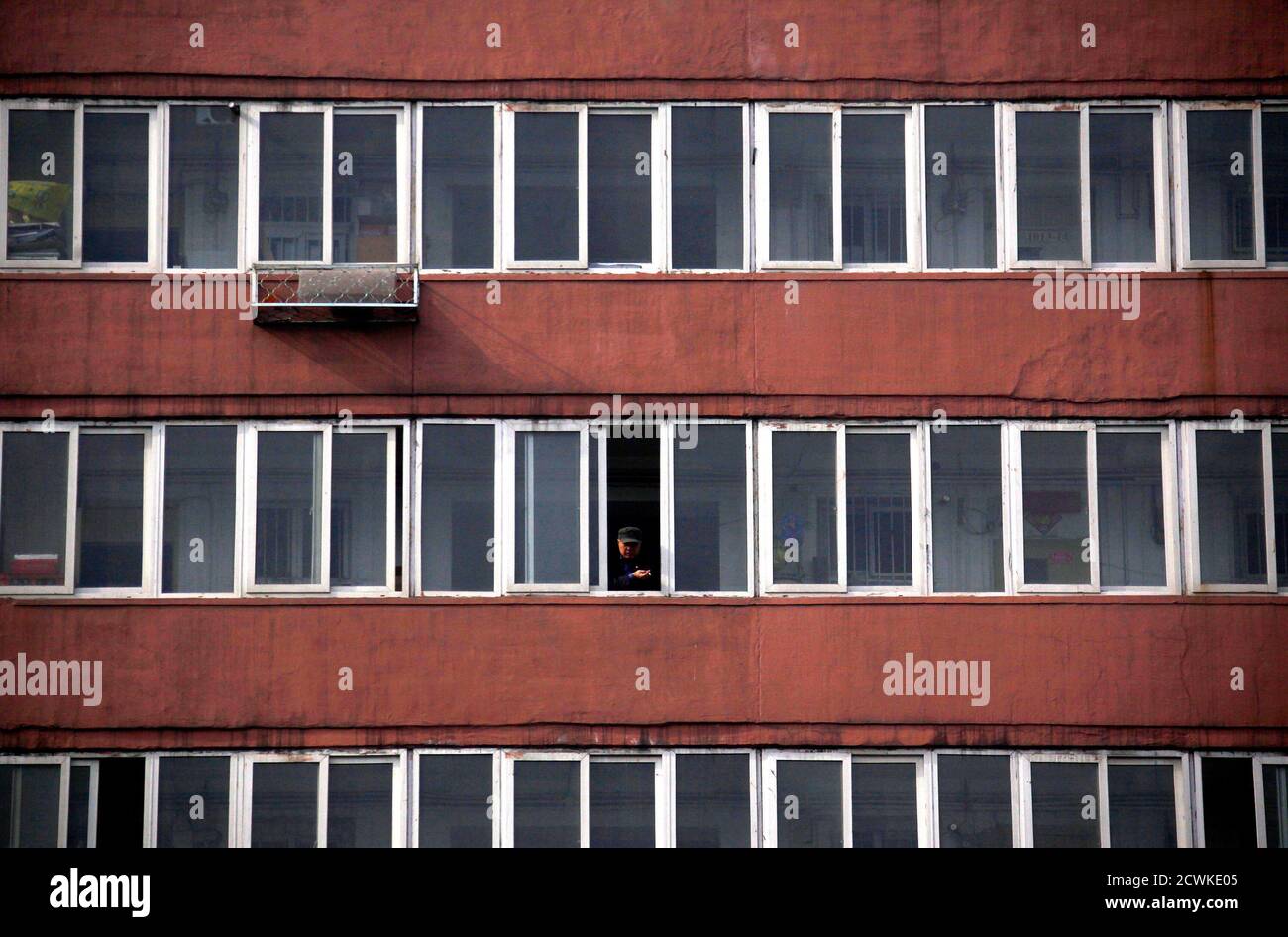 Man Smoking Out Window In High Resolution Stock Photography And Images Alamy