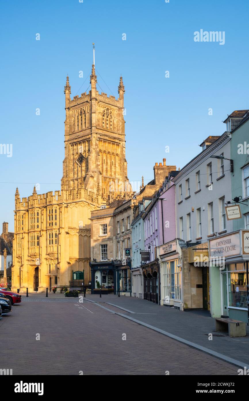 The Church of St. John the Baptist from the market place at sunrise in autumn. Cirencester, Cotswolds, Gloucestershire, England Stock Photo