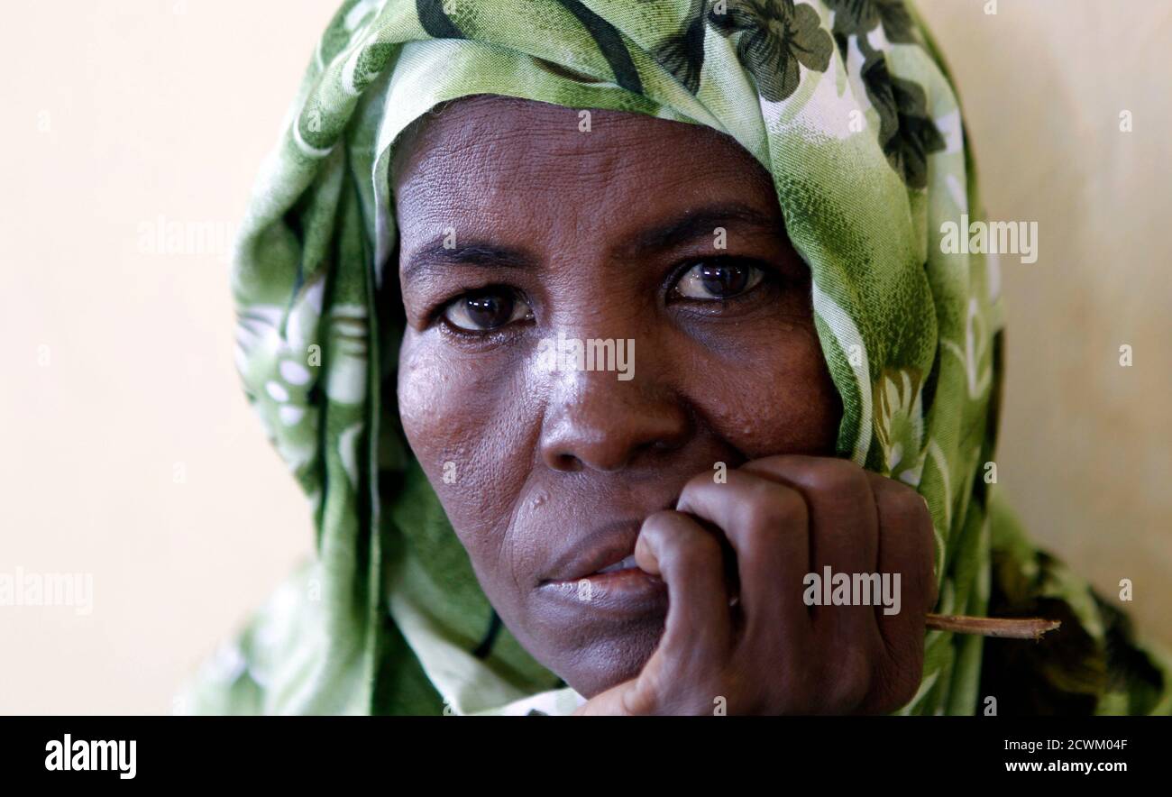 A sick Somali woman waits for treatment at the Dobley General hospital in Dobley town, 10 km (6 miles) from the Kenya-Somalia border, February 21, 2012.  REUTERS/Thomas Mukoya (SOMALIA - Tags: HEALTH CIVIL UNREST) Stock Photo