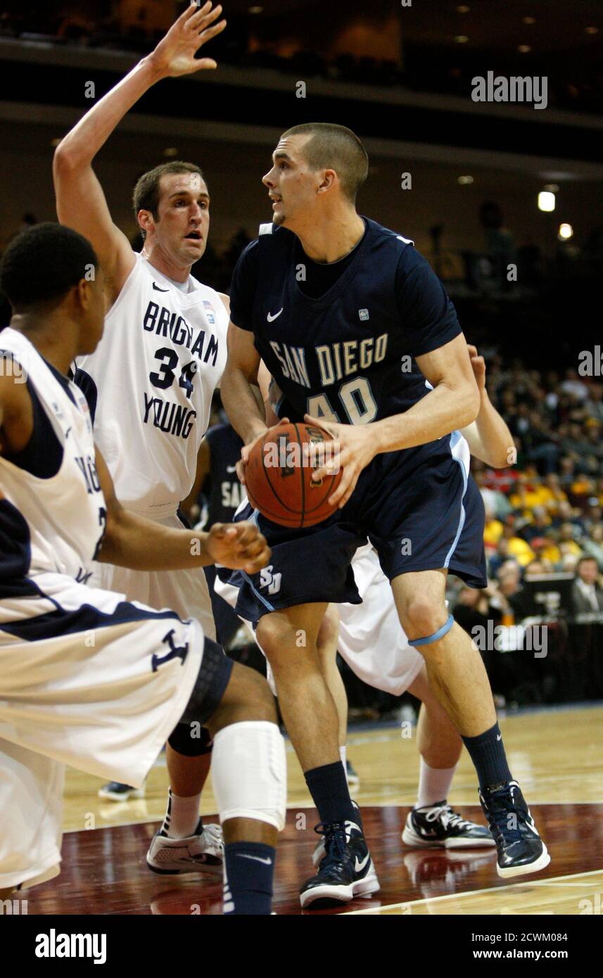 San Diego Toreros' Dennis Kramer (R) looks for a shot as BYU Cougars' Noah Hartsock defends during the West Coast Conference Championships basketball tournament at the Orleans Arena in Las Vegas, Nevada March 2, 2012. REUTERS/Steve Marcus (UNITED STATES) Stock Photo