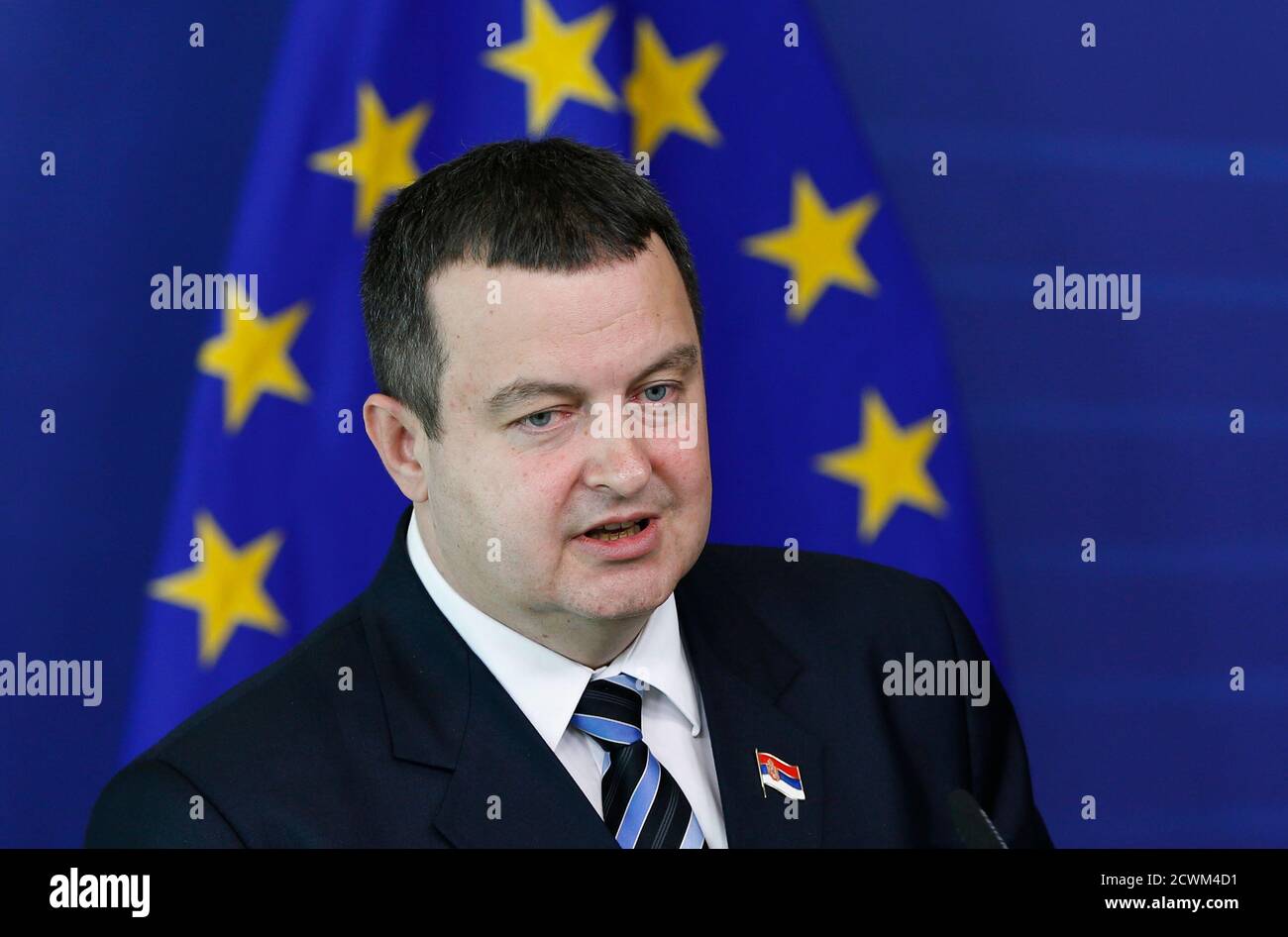 Serbian Prime Minister Ivica Dacic addresses a news conference after meeting European Commision President Jose Manuel Barroso (unseen) at the EU Commission headquarters in Brussels June 26, 2013. Serbia could start negotiations on joining the European Union by January next year, EU ministers agreed on Tuesday, rewarding Belgrade for improving relations with its ex-province Kosovo.    REUTERS/Francois Lenoir (BELGIUM - Tags: POLITICS BUSINESS) Stock Photo
