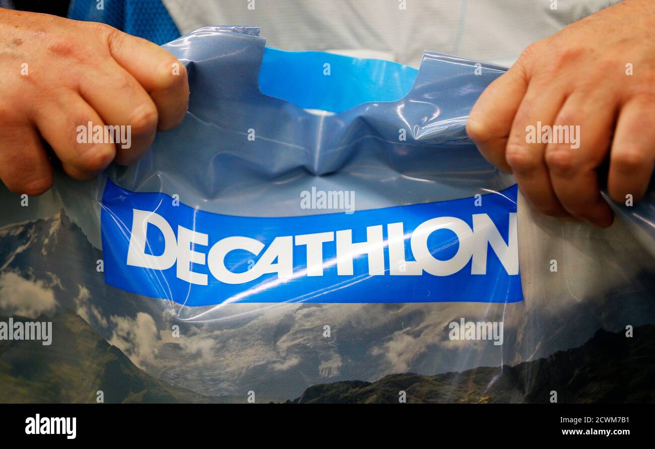 A customer holds a plastic bag at the French sports equipment and sportswear  company Decathlon store in Merignac near Bordeaux July 10, 2014. The group,  number one in French distribution of sports
