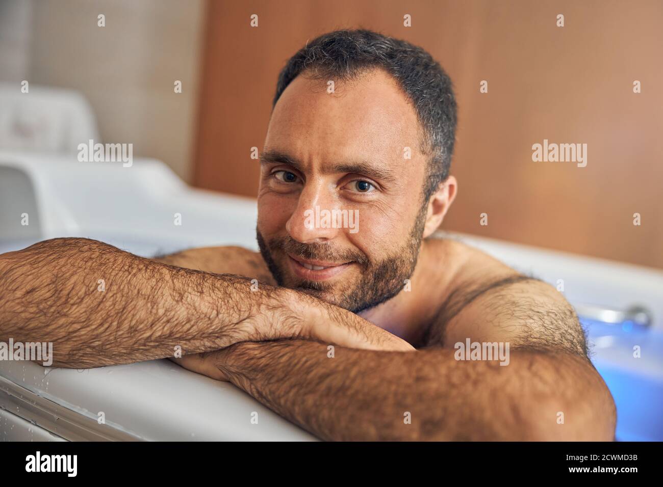 Handsome young man with stubble relaxing in bathtub Stock Photo Alamy