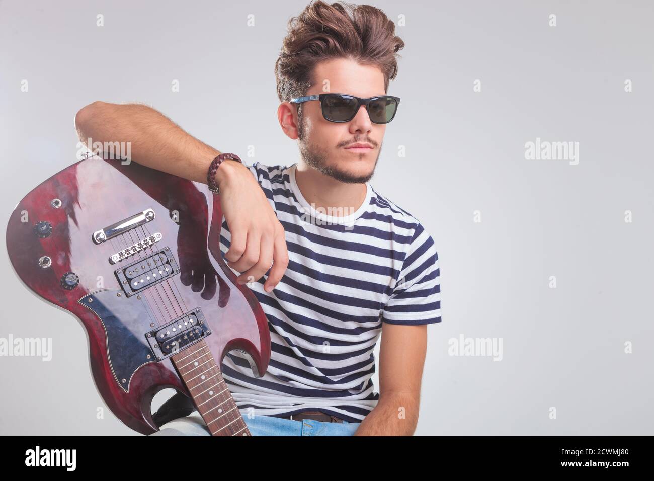 A Handsome Boy With Electric Guitar Posing. Stock Photo, Picture and  Royalty Free Image. Image 27932040.