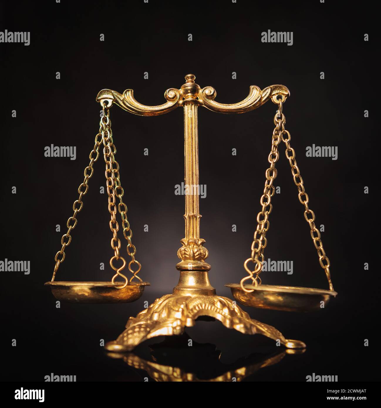 symbol-of-justice-golden-law-scales-on-dark-studio-background-stock