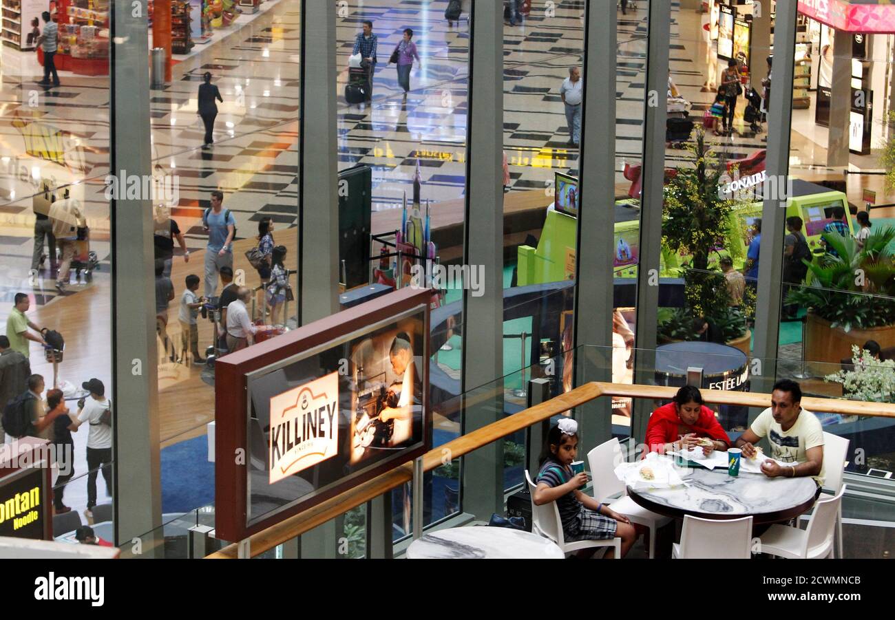 A Family Eats At A Restaurant Overlooking The Transit Area Of Terminal 3 Of Singapore S Changi Airport August 20 2013 Singapore S Ambitious Project To Double Its Air Passenger Handling Capacity By The