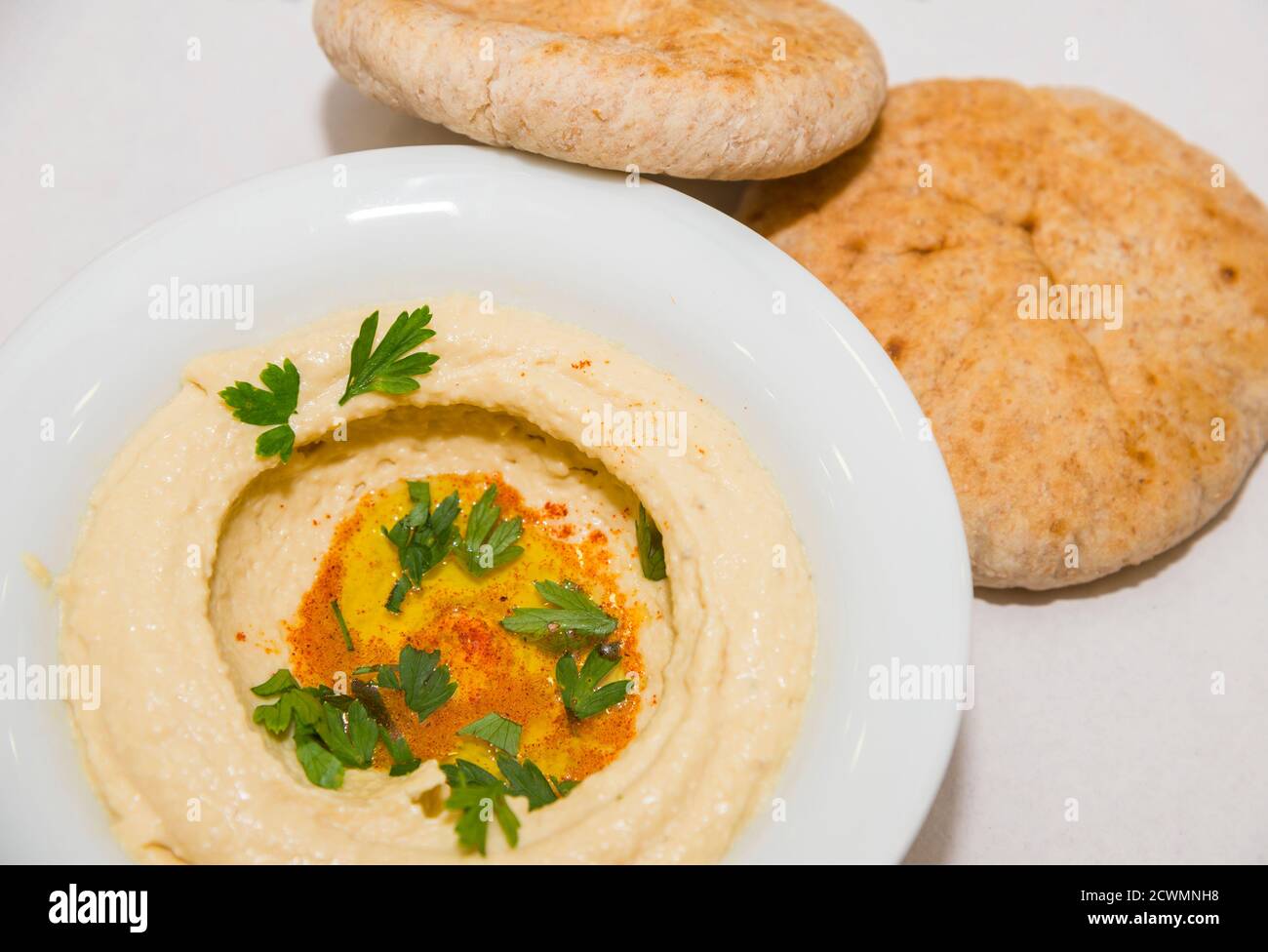 Fresh hummus with spices and pita bread Stock Photo - Alamy