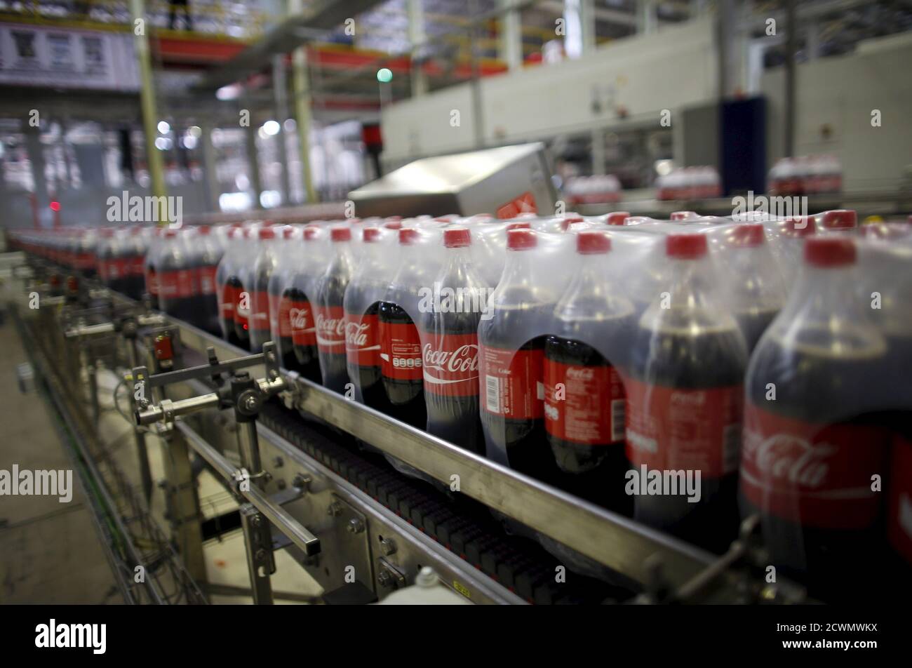 Bottles of Coca-Cola are pictured on a newly inaugurated production line at the Cikedokan Plant in Bekasi, West Java near Jakarta March 31, 2015. The Coca-Cola company inaugurated two new production lines as part of an investment package worth some $500 million to accelerate growth in the Indonesian market. REUTERS/Darren Whiteside Stock Photo