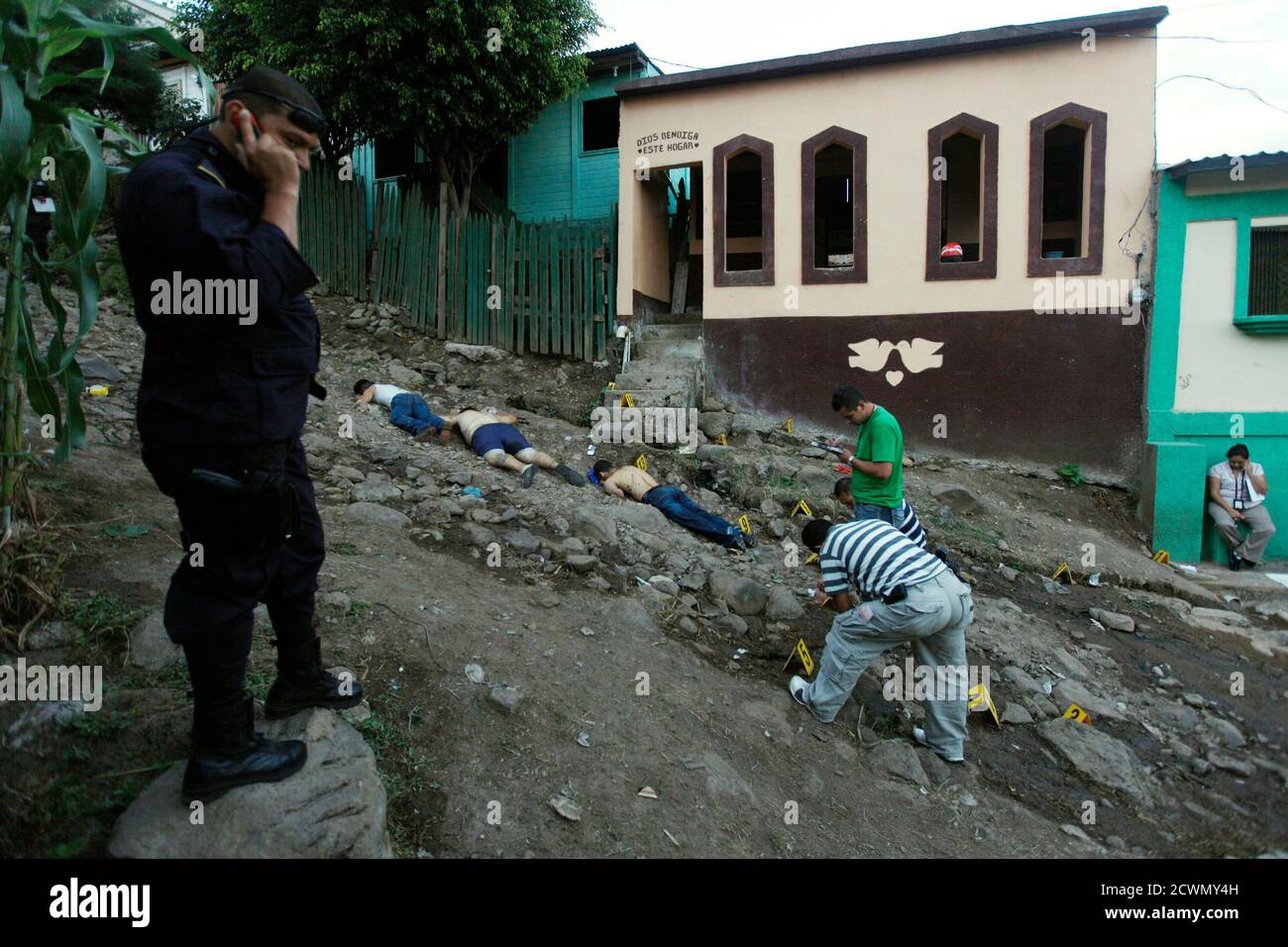 ATTENTION EDITORS - VISUAL COVERAGE OF SCENES OF INJURY OR DEATH Three unidentified slain men lay dead at Nueva Danli neighborhood in Tegucigalpa, November 28, 2010. According to Ramon Custodio, National Commissioner of Human Rights, the rate of homicides in 2010 in Honduras was of 72.8 homicides per 100,000 inhabitants, the highest in the world. REUTERS/Edgard Garrido (HONDURAS - Tags: OBITUARY CIVIL UNREST) Stock Photo