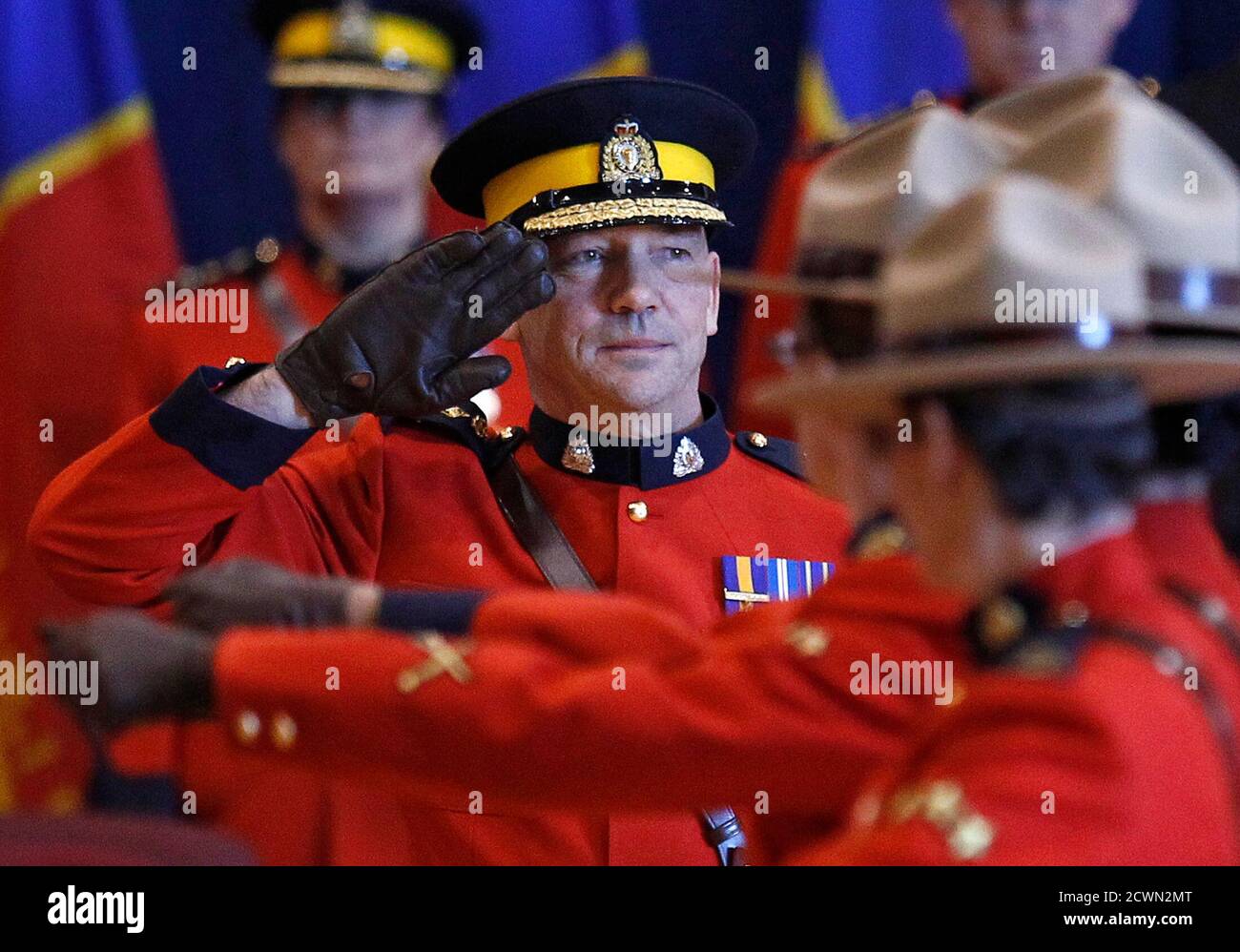 New Royal Canadian Mounted Police Commissioner Bob Paulson salutes during a change of command ceremony in Ottawa December 8, 2011.    REUTERS/Chris Wattie    (CANADA - Tags: POLITICS MILITARY) Stock Photo