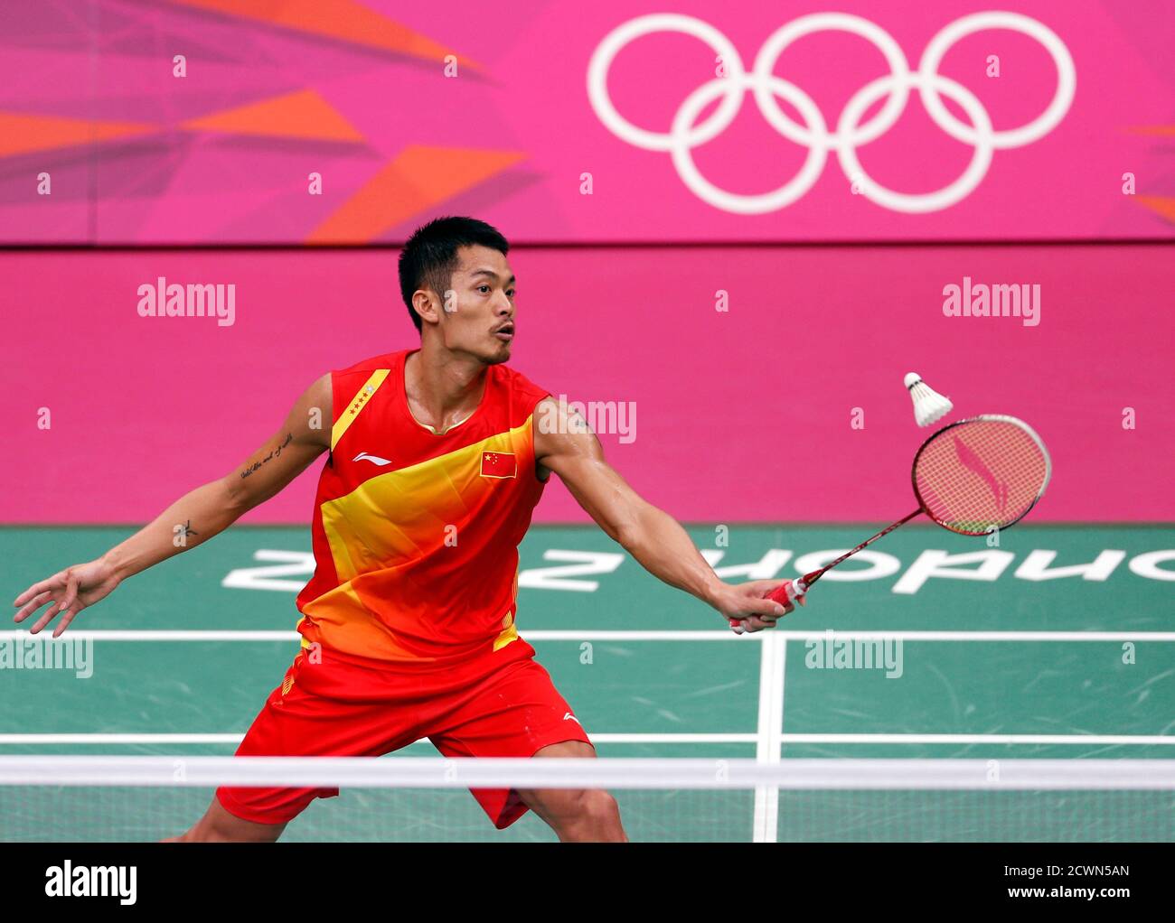 China S Lin Dan Returns A Shot To Malaysia S Lee Chong Wei During Their Men S Singles Badminton Gold Medal Match At The London 2012 Olympic Games At The Wembley Arena August 5 2012