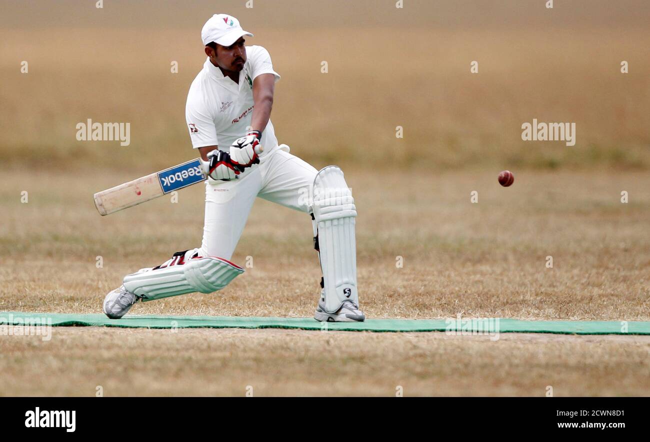 Harmanda Singh of the Ambassadors of Cricket from India plays a shot against the Maasai Cricket Warriors in a T20 cricket match in Ol Pejeta conservency in Laikipia national park, June 6, 2013. The Maasai Cricket Warriors are role models in their communities where they actively campaign against retrogressive and harmful cultural practices, such as female genital mutilation and early childhood marriages, while fighting to eradicate discrimination against women in Maasailand. Through cricket, they hope to promote healthier lifestyles and to also spread awareness about HIV/AIDS amongst youth. REU Stock Photo