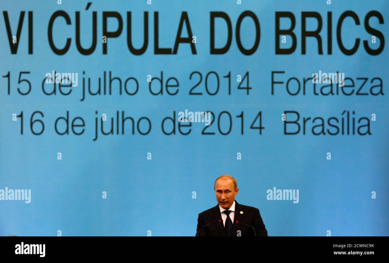 Russia's President Vladimir Putin delivers a speech as he attends the VI BRICS Summit in Fortaleza July 15, 2014. Leaders of Brazil, Russia, India, China and South Africa are holding an annual summit in Brazil this week where they are expected to sign a deal creating a $100 billion development bank and a currency reserve fund of the same amount. REUTERS/Paulo Whitaker (BRAZIL - Tags: POLITICS BUSINESS) Stock Photo
