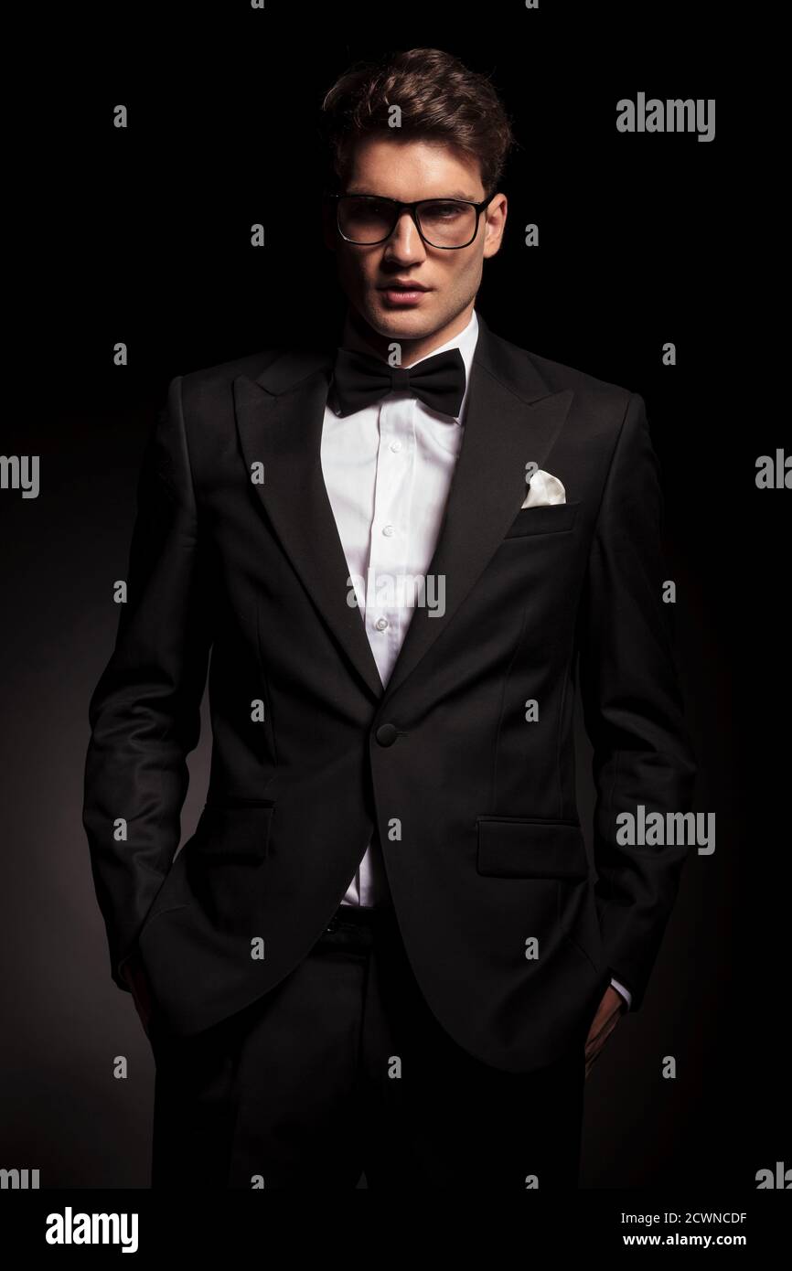 Picture of a young elegant man holding his hand in pockets Stock Photo ...