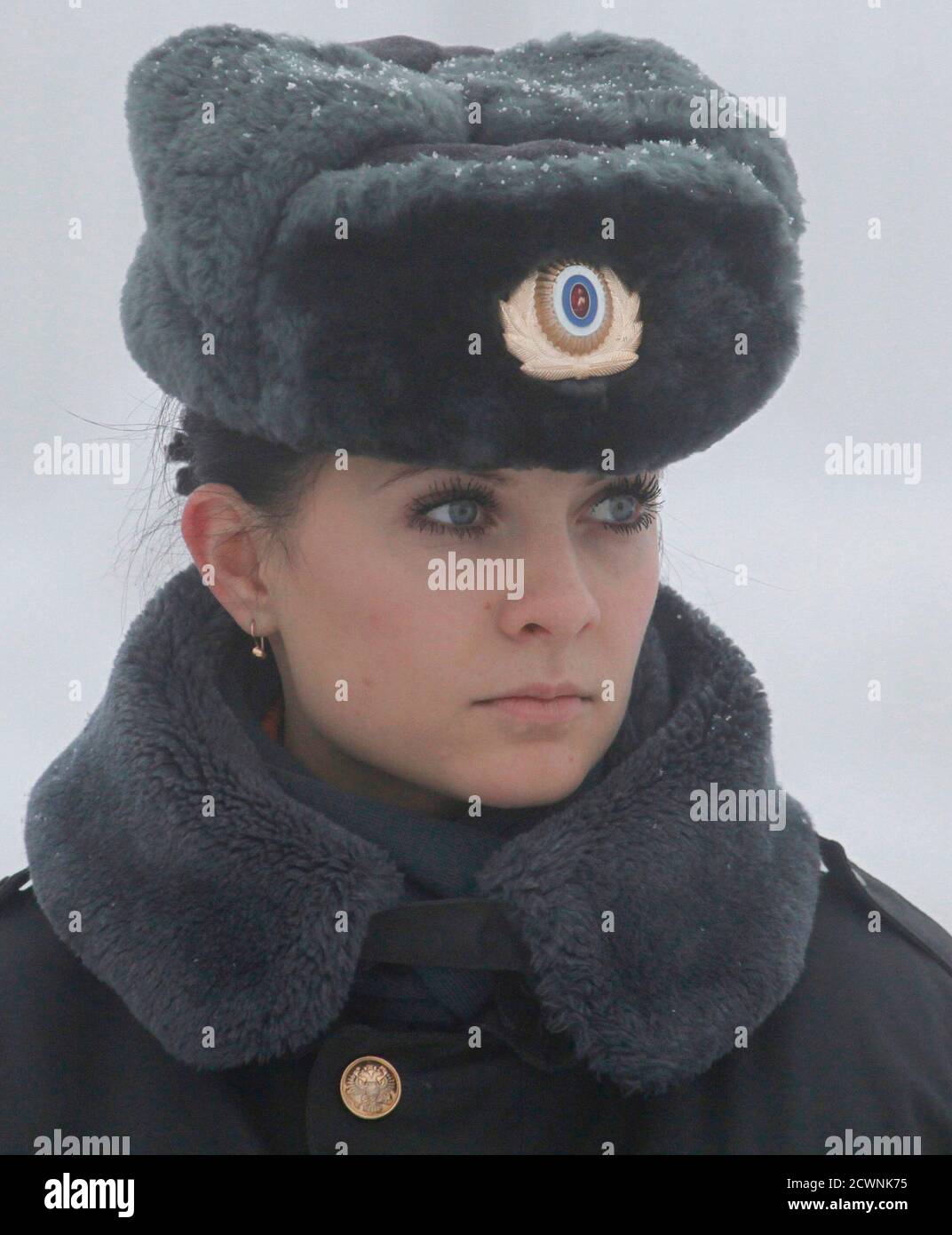 A female police officer waits for the 