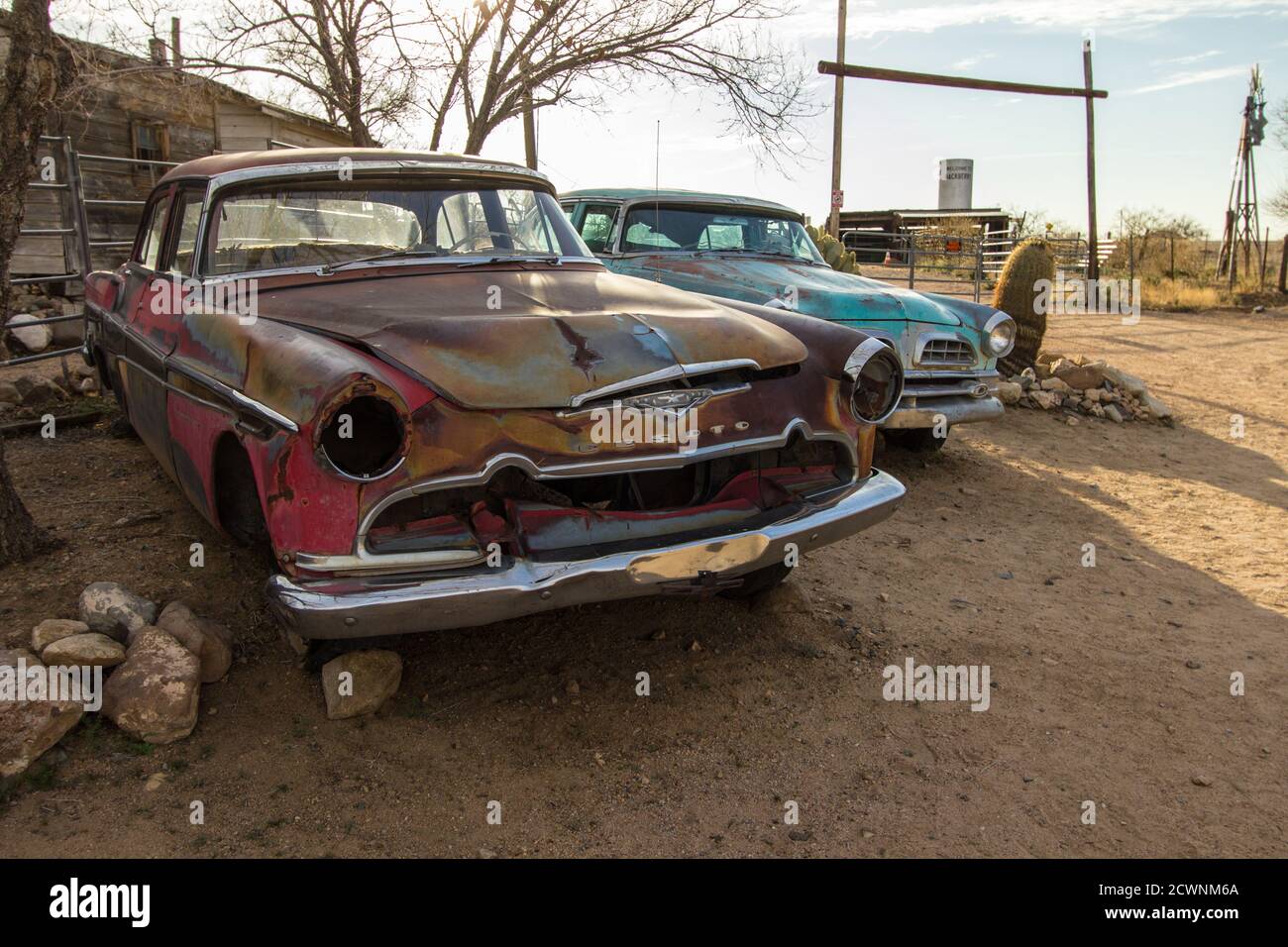 Hackberry, Arizona, USA - February 17, 2020: Two antique classic Chrysler Desoto automobiles in the remote desert of along Route 66 in Arizona. Stock Photo
