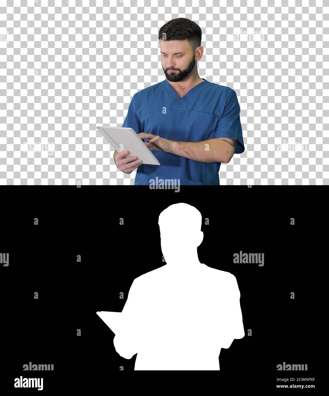 Confident concentrated focused surgeon using digital tablet, Alp Stock Photo