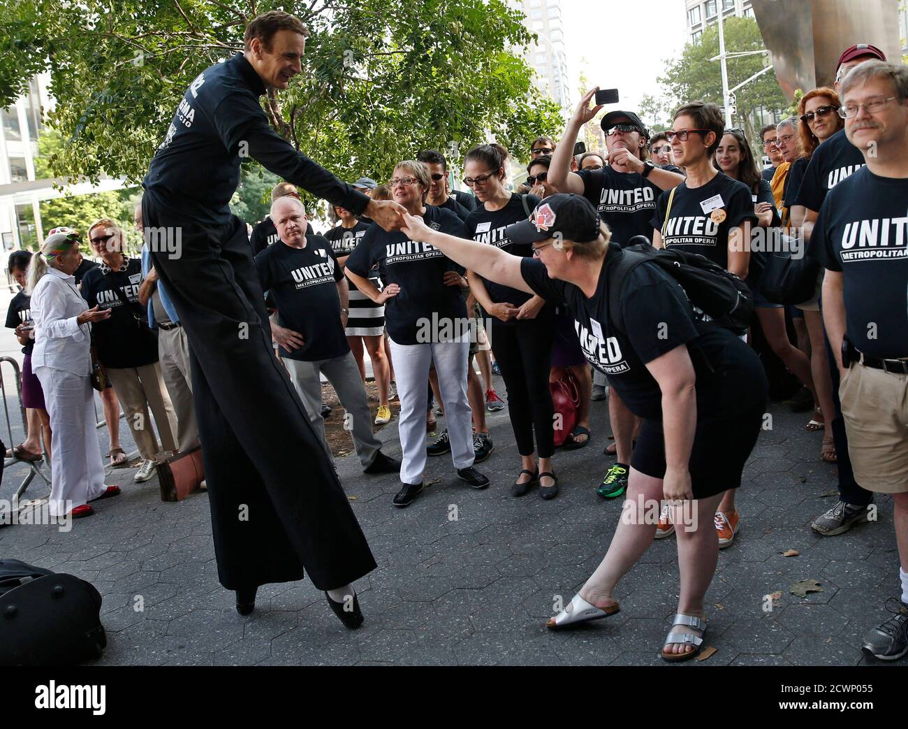 Woman man on stilts union hires stock photography and images Alamy