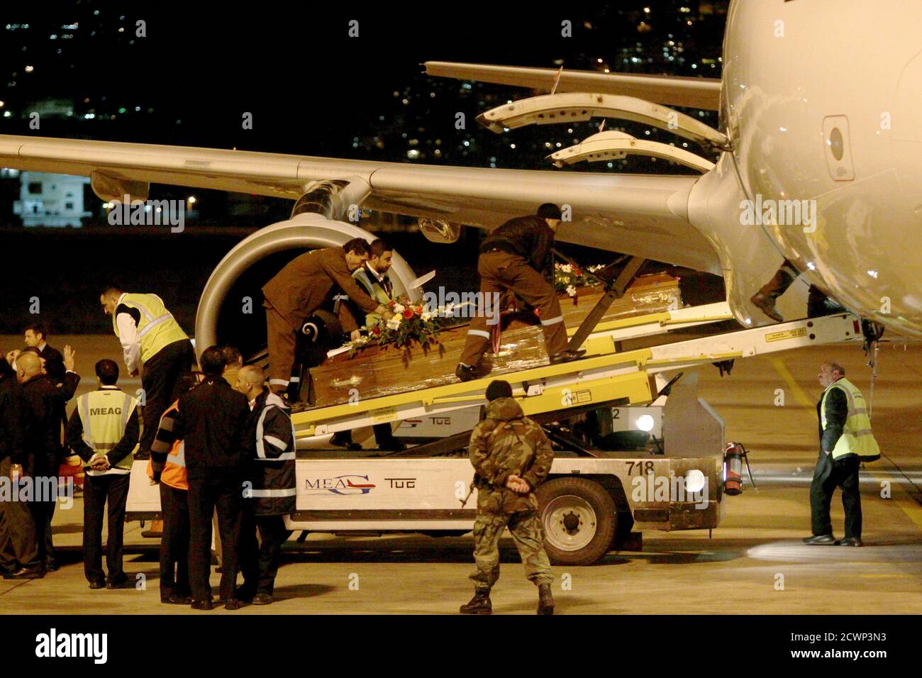 The coffins carrying the bodies of victims of a private plane that crashed yesterday in the city of Sulaimaniya in Iraq's semi-autonomous northern Kurdish region, are transported upon arrival at the Beirut international airport, February 5, 2011. The chief executive of private equity group MerchantBridge and two JPMorgan executives were among seven people killed when a small plane crashed in northern Iraq, officials said on Saturday. Airport officials said the businessmen on the plane had flown to Sulaimaniya to visit the offices of AsiaCell, one of Iraq's major mobile phone service providers, Stock Photo