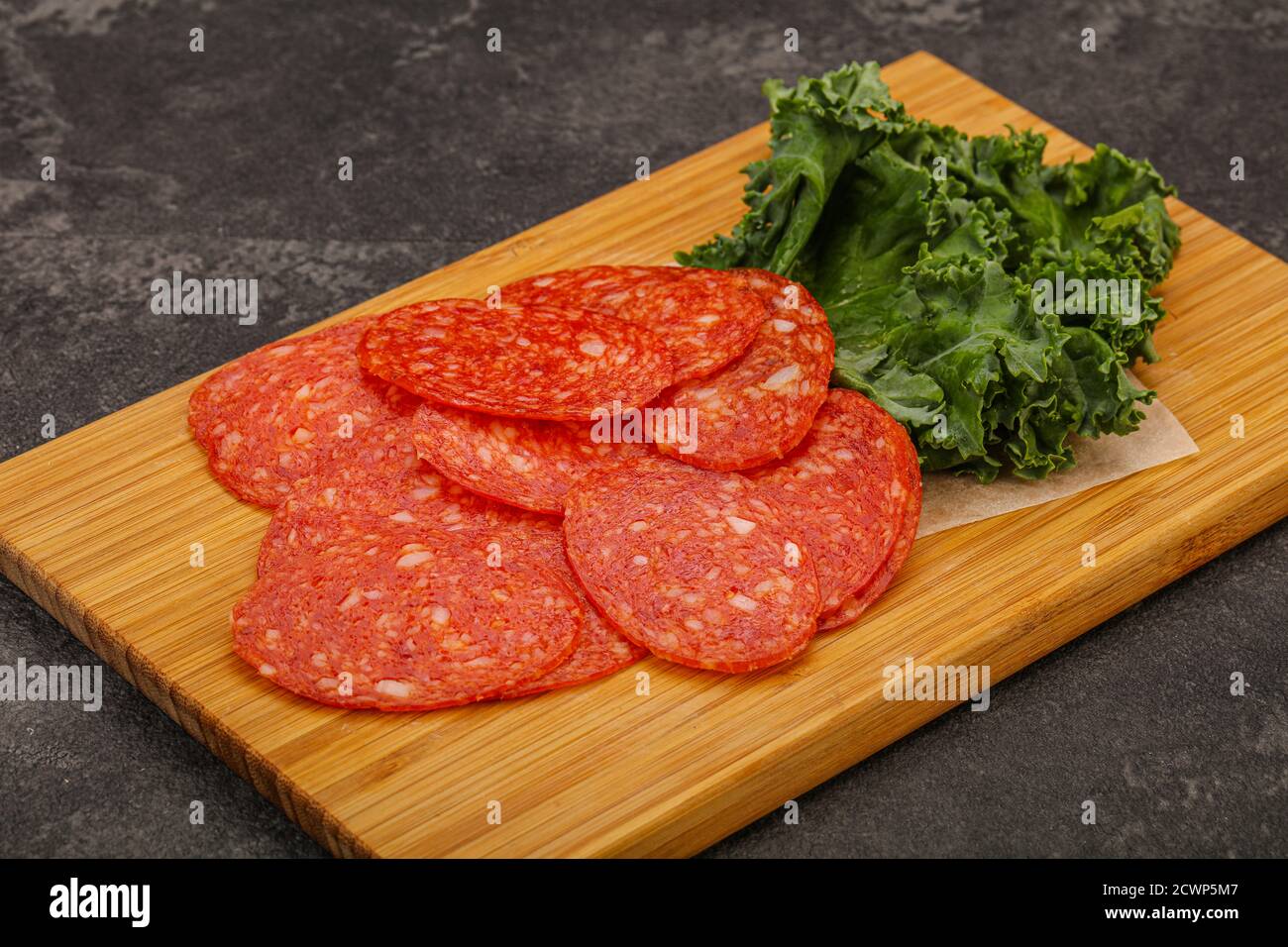 Italian spycy pepperoni sausage slices over board Stock Photo Alamy