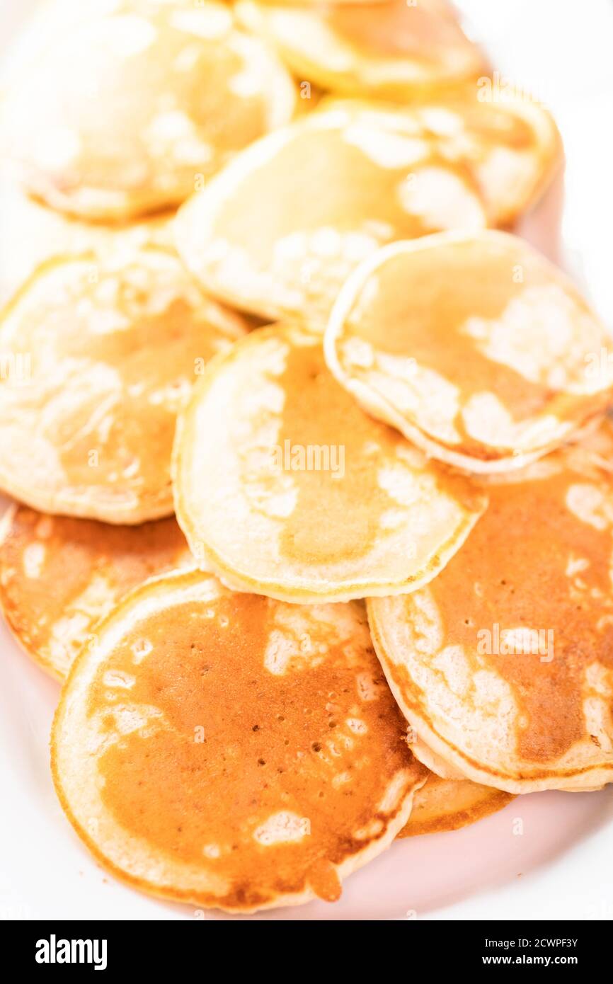 Freshly made small pancakes on a kefir base. Stock Photo