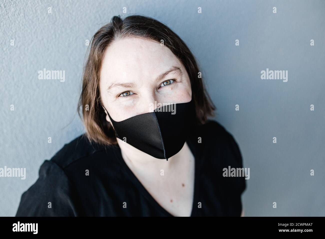 Caucasian Girl Wearing Black Mask High Resolution Stock Photography and ...