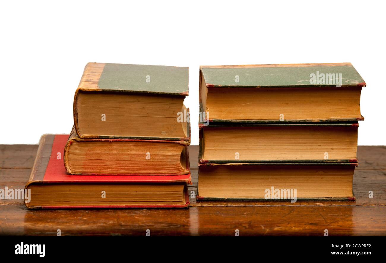 stack of old books on wooden table with white background Stock Photo ...
