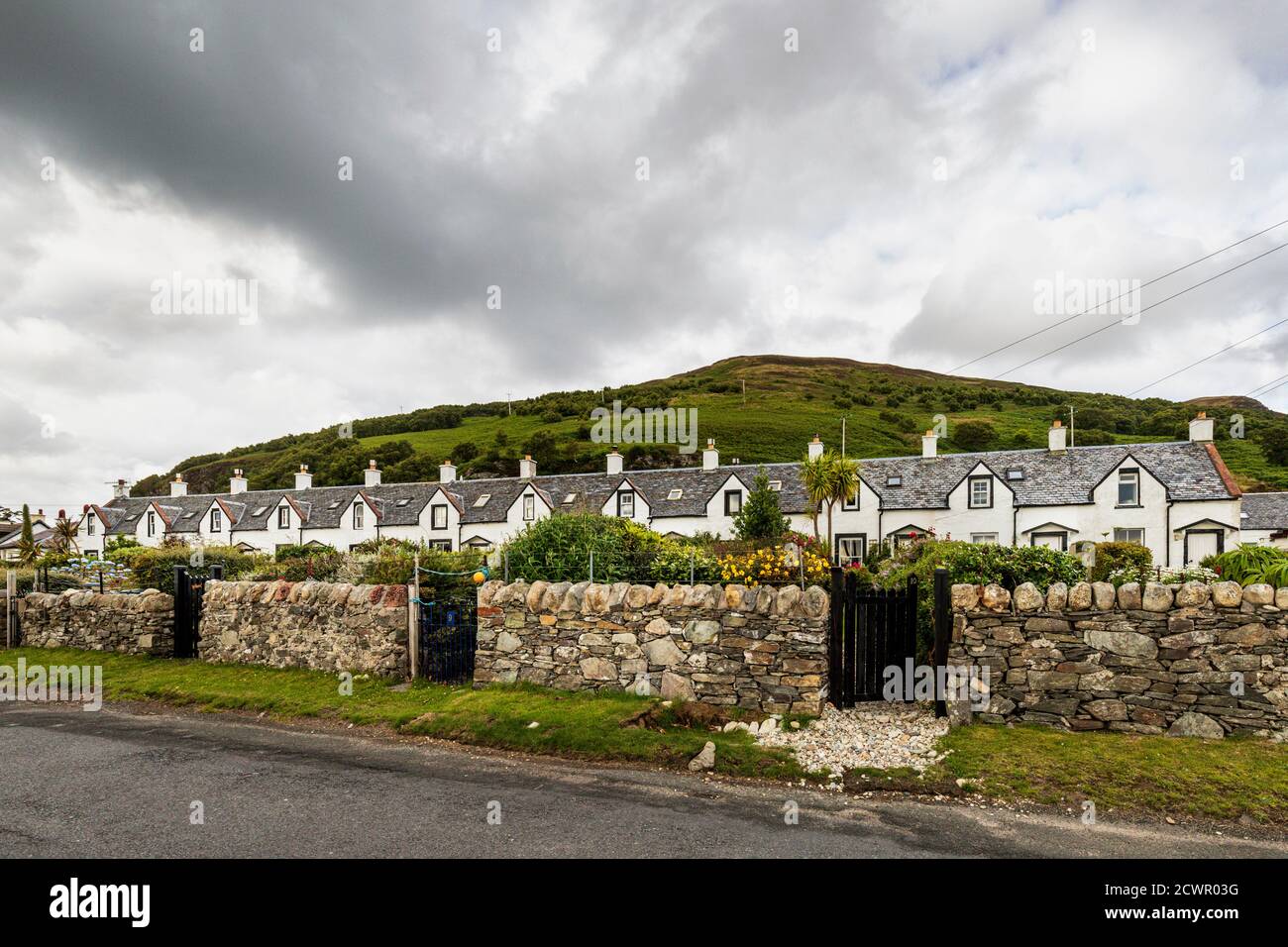 The Twelve Apostles, a row of fishermen's cottages, in Catacol, Isle of Arran, North Ayrshire, Scotland, UK Stock Photo