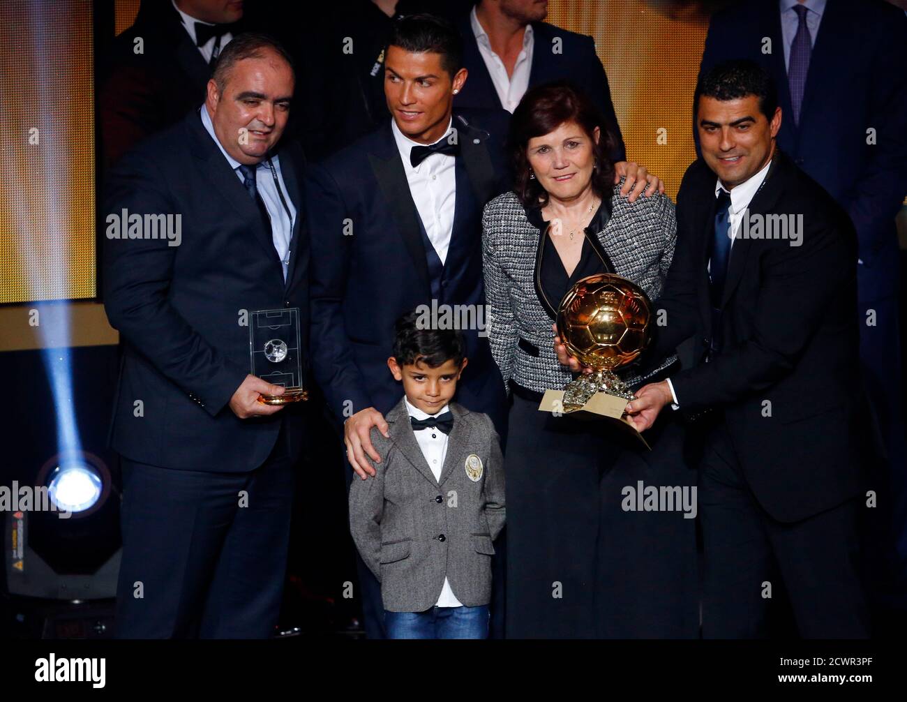 FIFA Ballon d'Or winner Cristiano Ronaldo (C) poses with his mother Maria  Dolores dos Santos Aveiro (2nd R) and son Cristiano Ronaldo Jr. after the  FIFA Ballon d'Or 2014 soccer awards ceremony