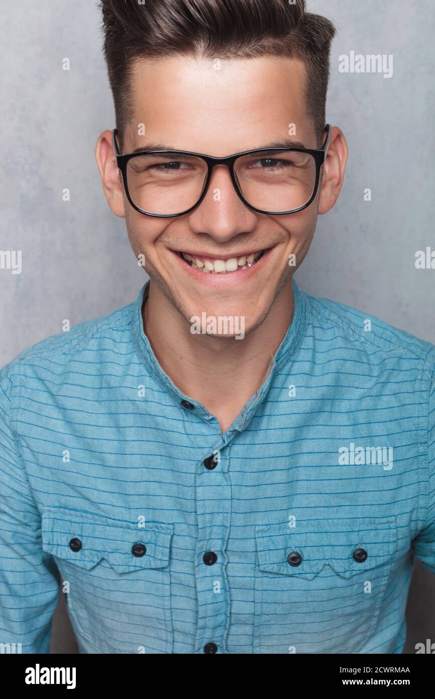 Close up portrait of a young casual man smiling to the camera Stock ...