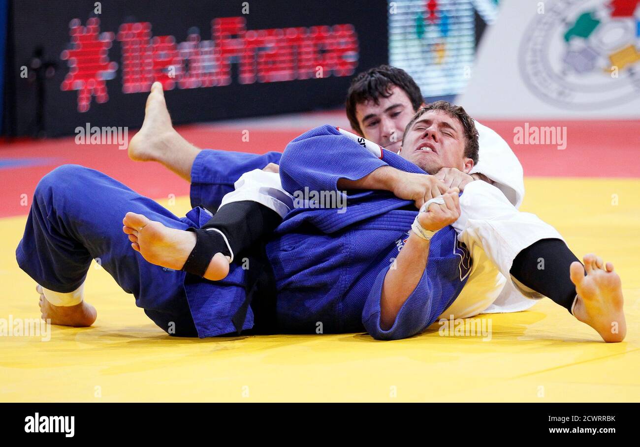 Loic Pietri of France (R) competes with Sergiu Toma of Moldova during their  under 81kg men's bronze medal bout at the World Judo Championships in Paris  August 25, 2011. REUTERS/Yves Herman (FRANCE -