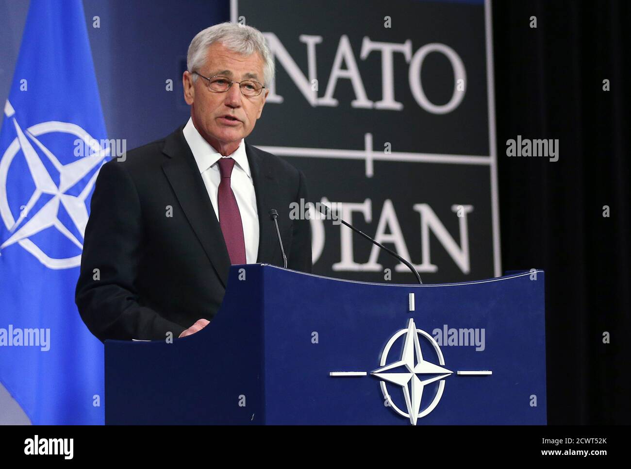 U.S. Secretary of Defense Chuck Hagel addresses a news conference during a NATO defence ministers meeting at the Alliance headquarters in Brussels February 27, 2014. Russia must be transparent about military exercises along Ukraine's border and not take any steps that could be misinterpreted or "lead to miscalculation during a delicate time," Hagel said on Thursday. REUTERS/Francois Lenoir (BELGIUM - Tags: POLITICS MILITARY) Stock Photo