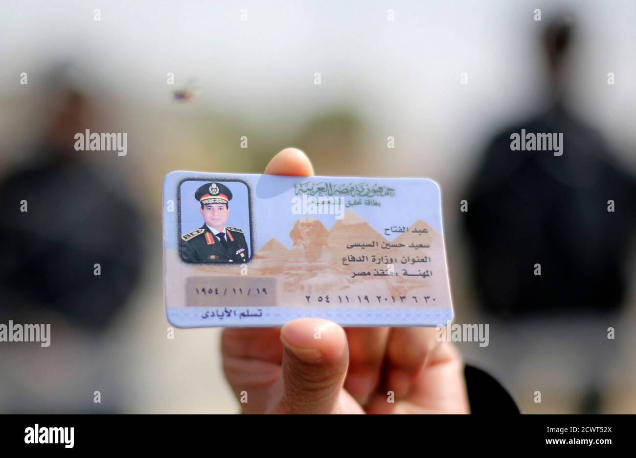 A Supporter Of Egypt S Army Chief Field Marshal Abdel Fattah Al Sisi Displays A Fake Identification Of Sisi Which Is Part Of The Paraphernalia In Support Of His Potential Candidacy In The Upcoming