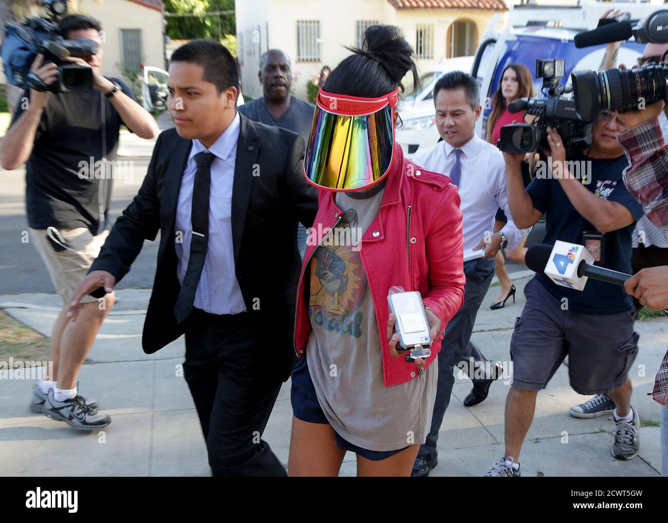 Model who uses the name V. Stiviano walks outside her home in Los Angeles, California April 28, 2014. Los Angeles Clippers players staged a protest at a playoff game on Sunday against racist comments allegedly made by team owner Donald Sterling, turning their warm-up jerseys inside-out to hide the team name before a loss to the Golden State Warriors. The silent demonstration came as Sterling faced a firestorm of criticism over a 10-minute recording obtained by celebrity news website TMZ in which a man reported to be the NBA owner tells Stiviano not to post photographs of herself with black peo Stock Photo