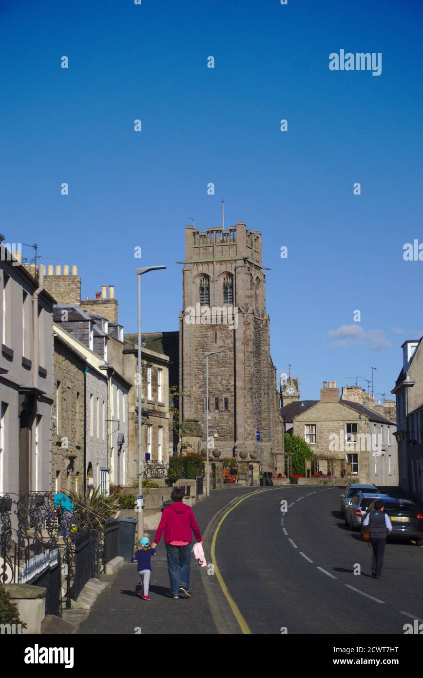 View along High Street, Coldstream, Berwickshire, Scottish Borders, with Coldstream Community Centre (formerly St Cuthbert's church) middle distance. Stock Photo