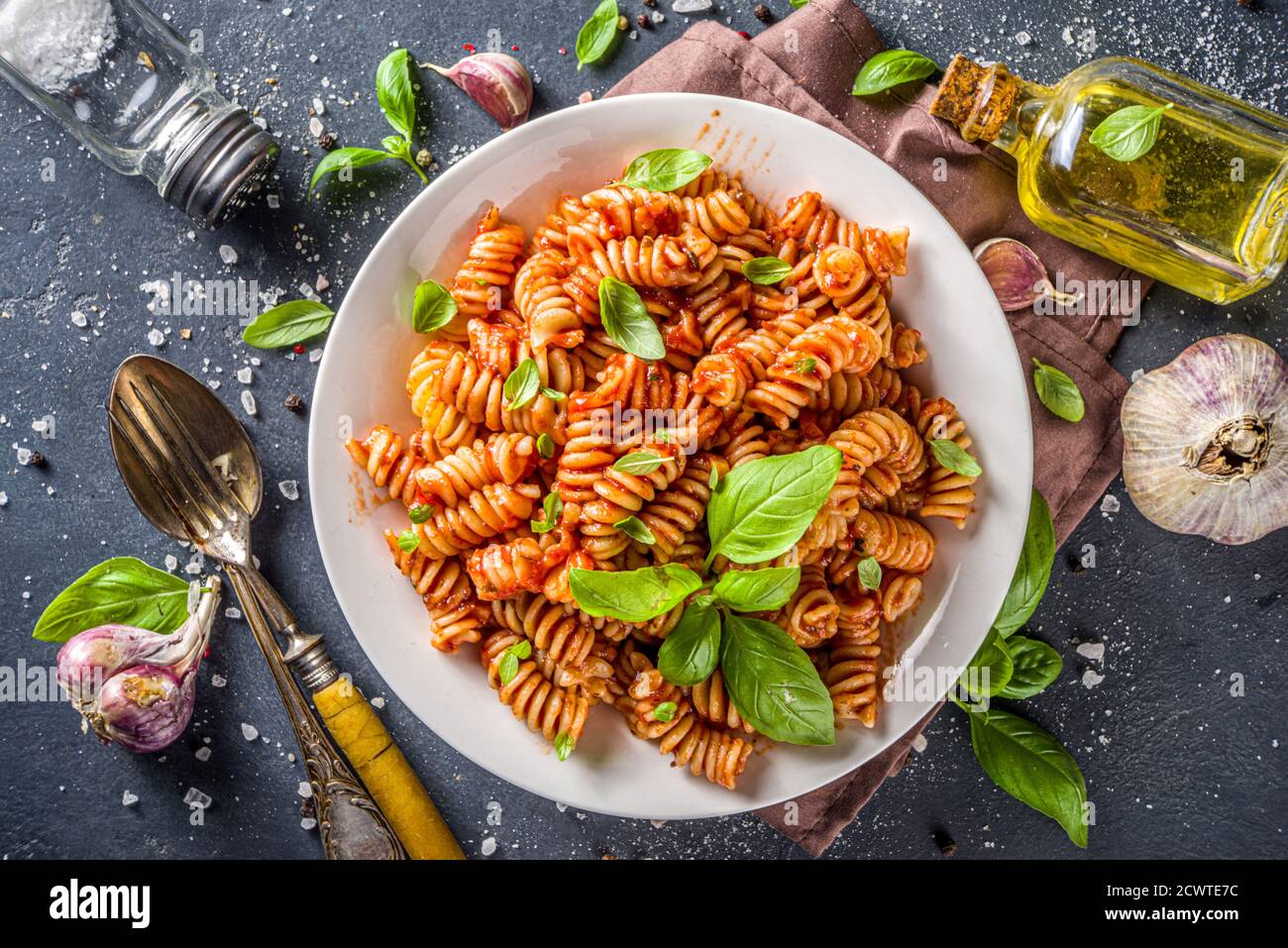 Fusilli pasta with tomato sauce and basil. Traditional italian Fusilli  pasta marinara, on dark background copy space Stock Photo - Alamy