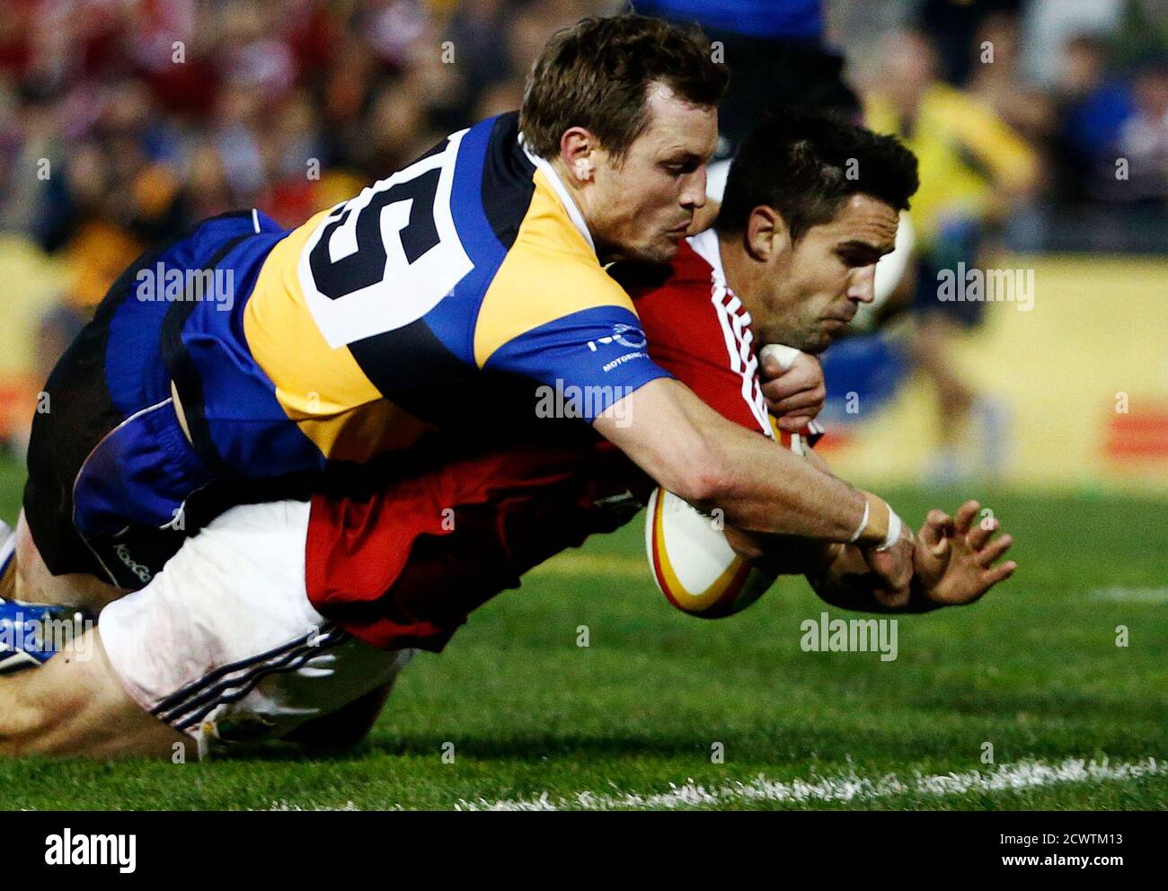British and Irish Lions' Conor Murray (R) scores a try as Nathan Trist of the Combined NSW-Queensland Country fails to stop him during their rugby union game at Hunter Stadium in Newcastle June 11, 2013.   REUTERS/Daniel Munoz  (AUSTRALIA - Tags: SPORT RUGBY) Stock Photo