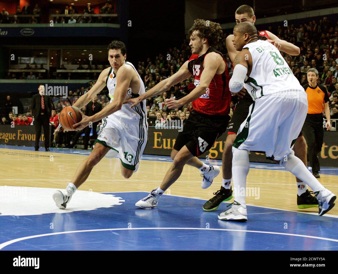 Dimitris Diamantidis (L) of Panaithinakos dribbles past Simas Jasaitis of  Lietuvos Rytas during their Euroleague Top 16 group E game in Vilnius  January 19, 2011. REUTERS/Ints Kalnins (LITHUANIA - Tags: SPORT BASKETBALL