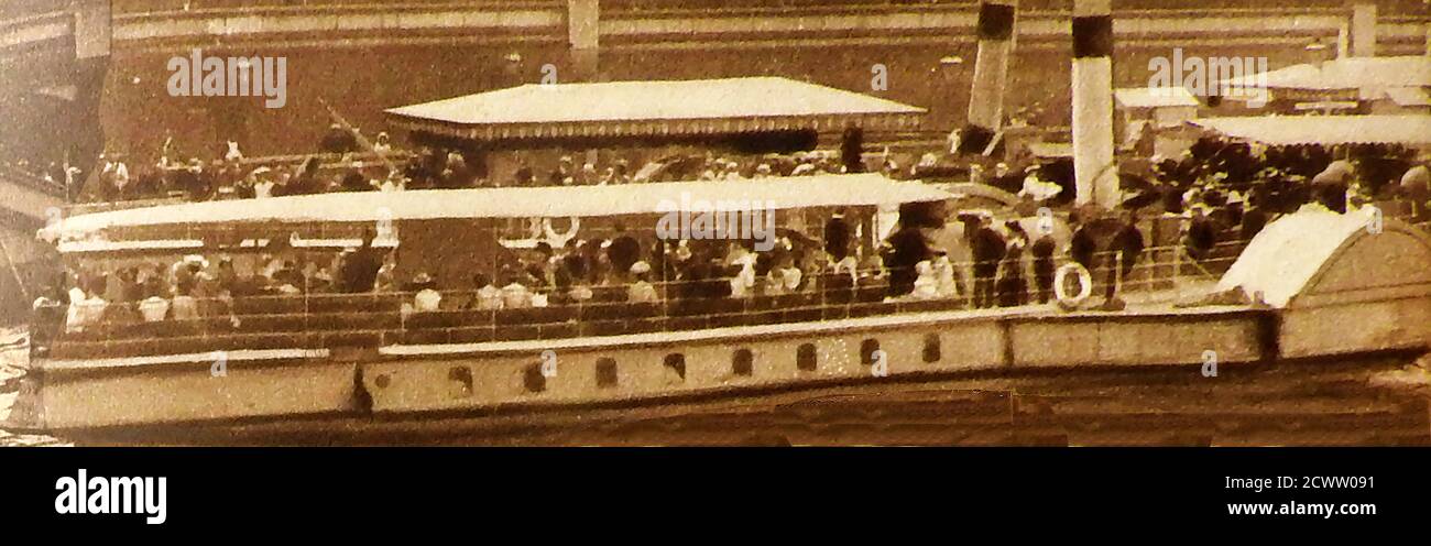 1905. One of the new L C C penny steamers, pleasure cruises that operated on the Thames, London, from that year.  - June 17th 1905 was the official innauguration of the L C C penny steamers / pleasure cruises by the British monarch King Edward VII on Westminster Pier. Unfortunately, the London County Council's experiment with a fleet of thirty small Thames paddle-steamers coincided with a time of cheaper,   faster and more reliable  bus and train transport. After a single season  fleet was sold for scrap at enormous financial loss. Stock Photo