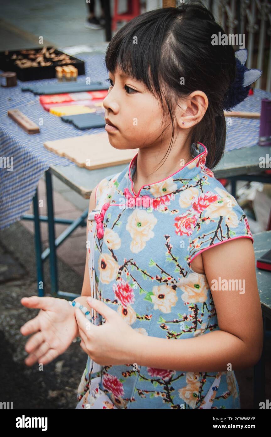 Young Asian girl captured during Chinese New Year Celebration in Malaysia Stock Photo