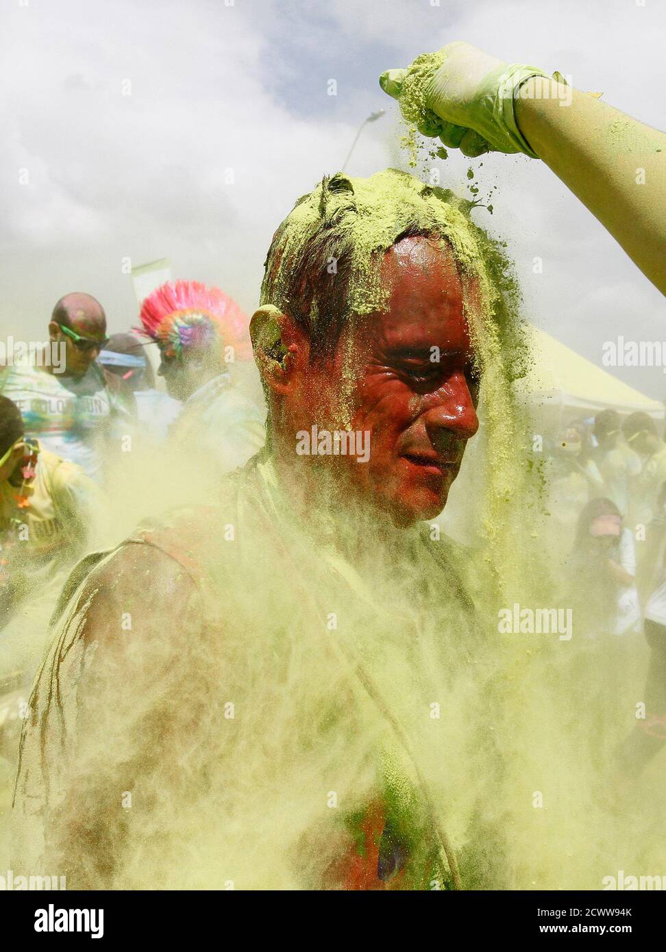 A Man Is Covered In Coloured Powder During The Color Run In Cali November 3 2013 The Color Run Is A Five Kilometre Untimed Race Held In Cities Worldwide With The Aim Of Participants wear white at the starting line and finish the race plastered in color. alamy