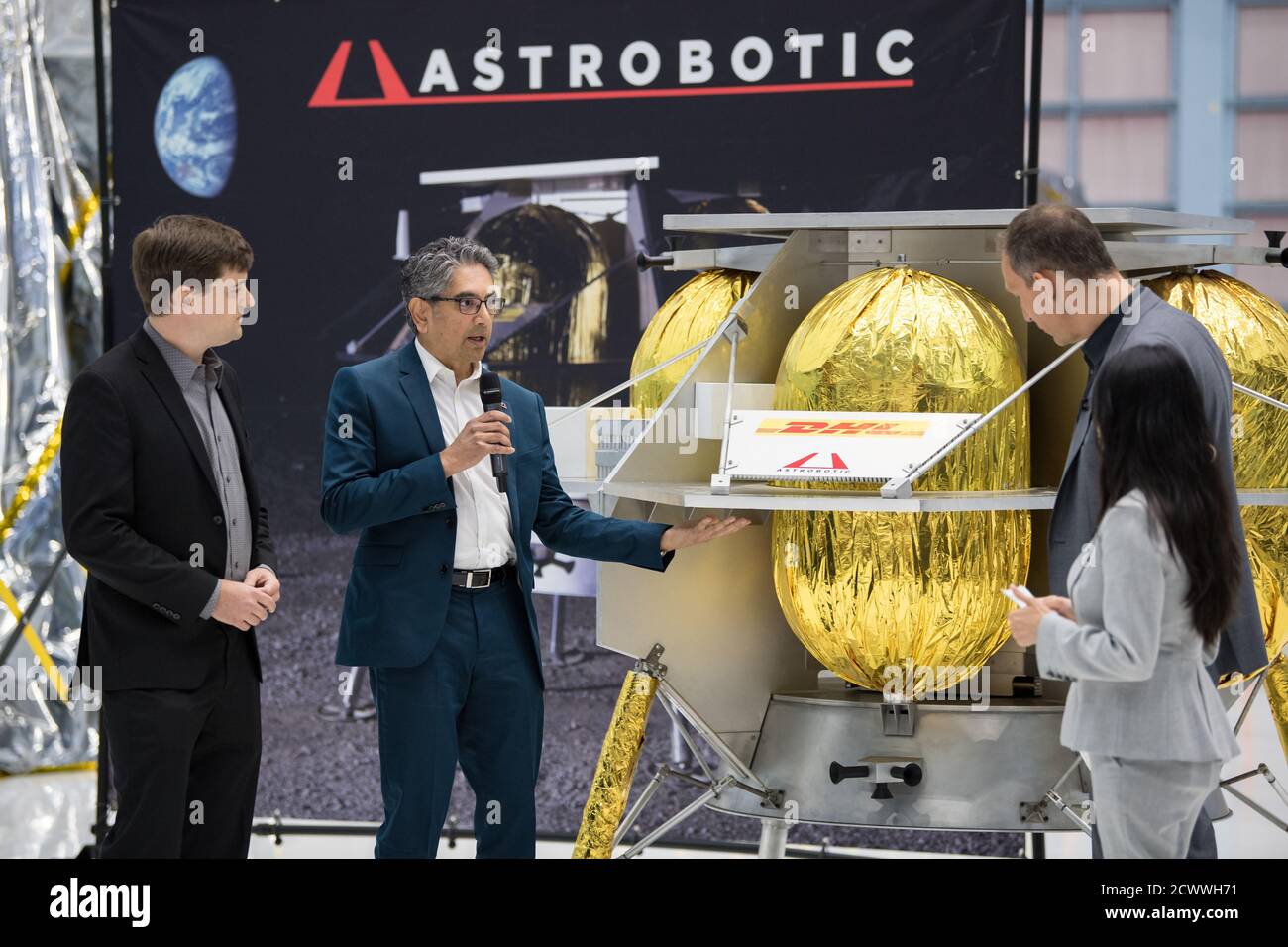 Commercial Lunar Payload Services Announcement NASA Associate Administrator, Science Mission Directorate, Thomas Zurbuchen, second from right, speaks to Astrobotic CEO, John Thornton, left, and Astrobotic Mission Director, Sharad Bhaskaran, second from left, about their lunar lander, Friday, May 31, 2019, at Goddard Space Flight Center in Md. Astrobotic, Intuitive Machines, and Orbit Beyond have been selected to provide the first lunar landers for the Artemis program's lunar surface exploration. " Stock Photo