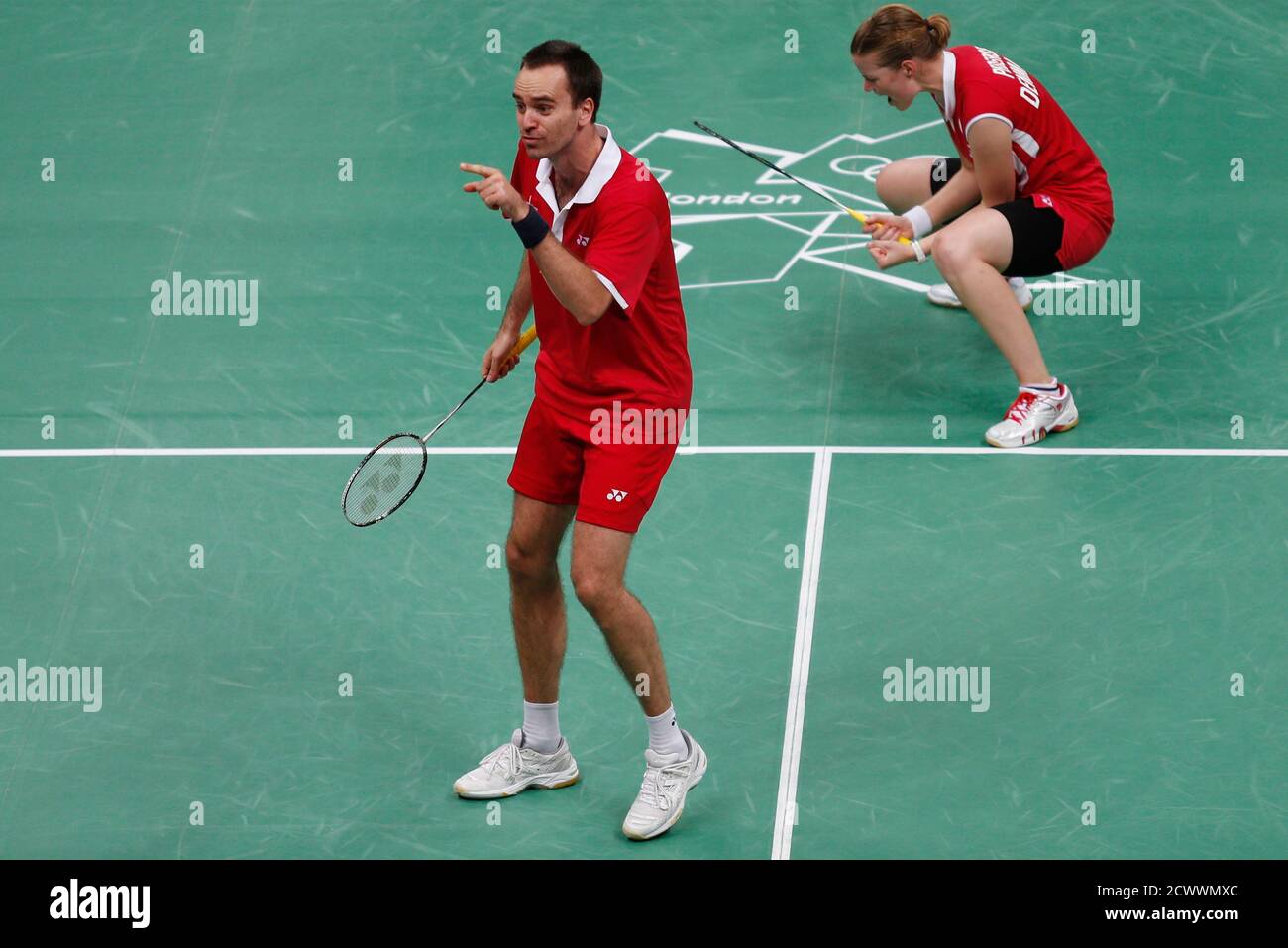 Denmark's Joachim Fischer (L) and Christinna Pedersen celebrate winning  against Indonesia's Tontowi Ahmad and Liliyana Natsir during their mixed  doubles badminton bronze medal match during the London 2012 Olympic Games  at the