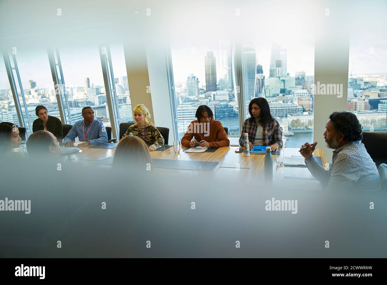 Business people talking in highrise conference room meeting Stock Photo