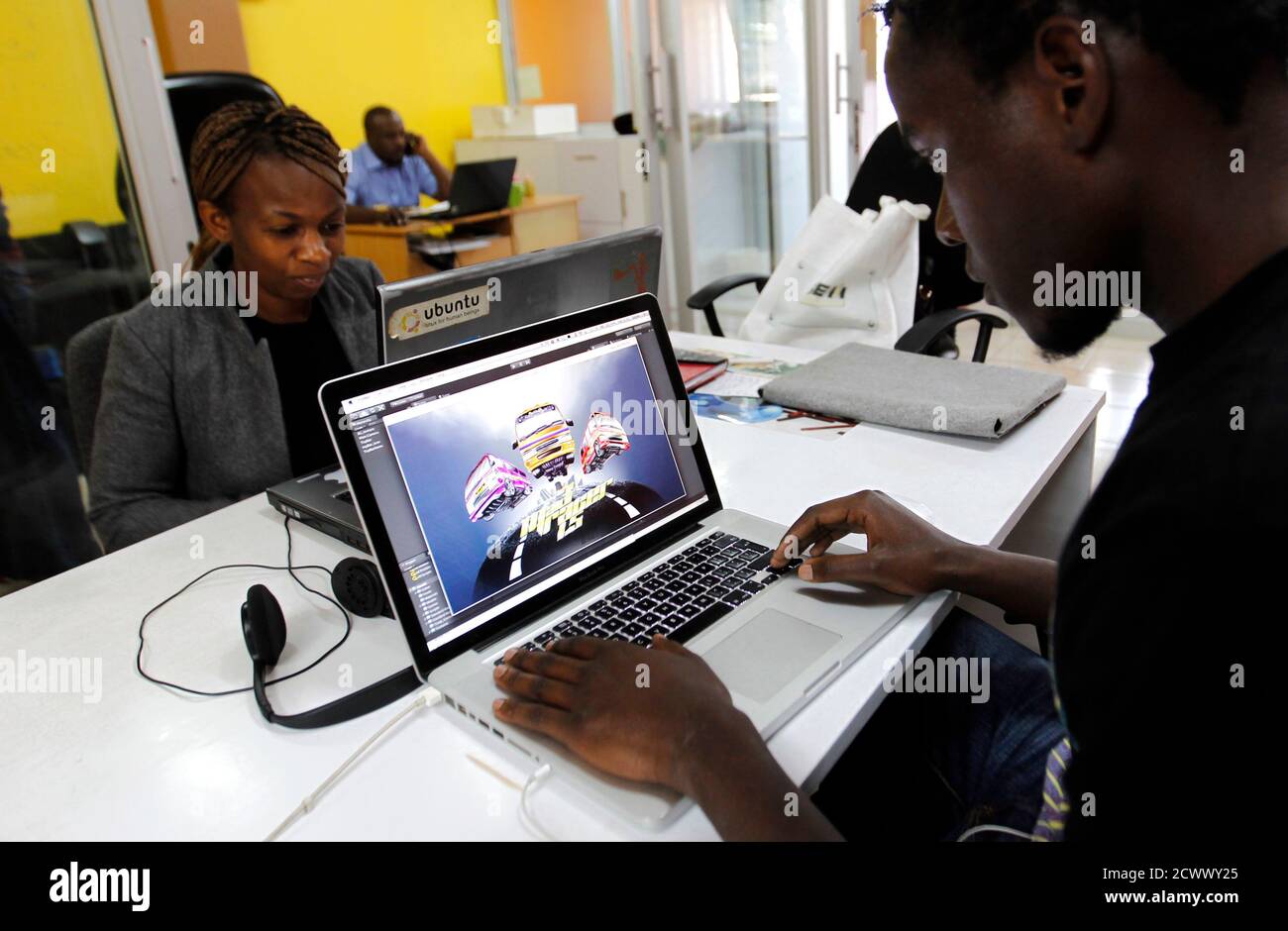 Duncan Onyango, a game design developer at Planet Rackus works on MA3Racer,  a 2D mobile game inside his studio in Kenya's capital Nairobi, July 15,  2014. Industry analysts have long hailed the