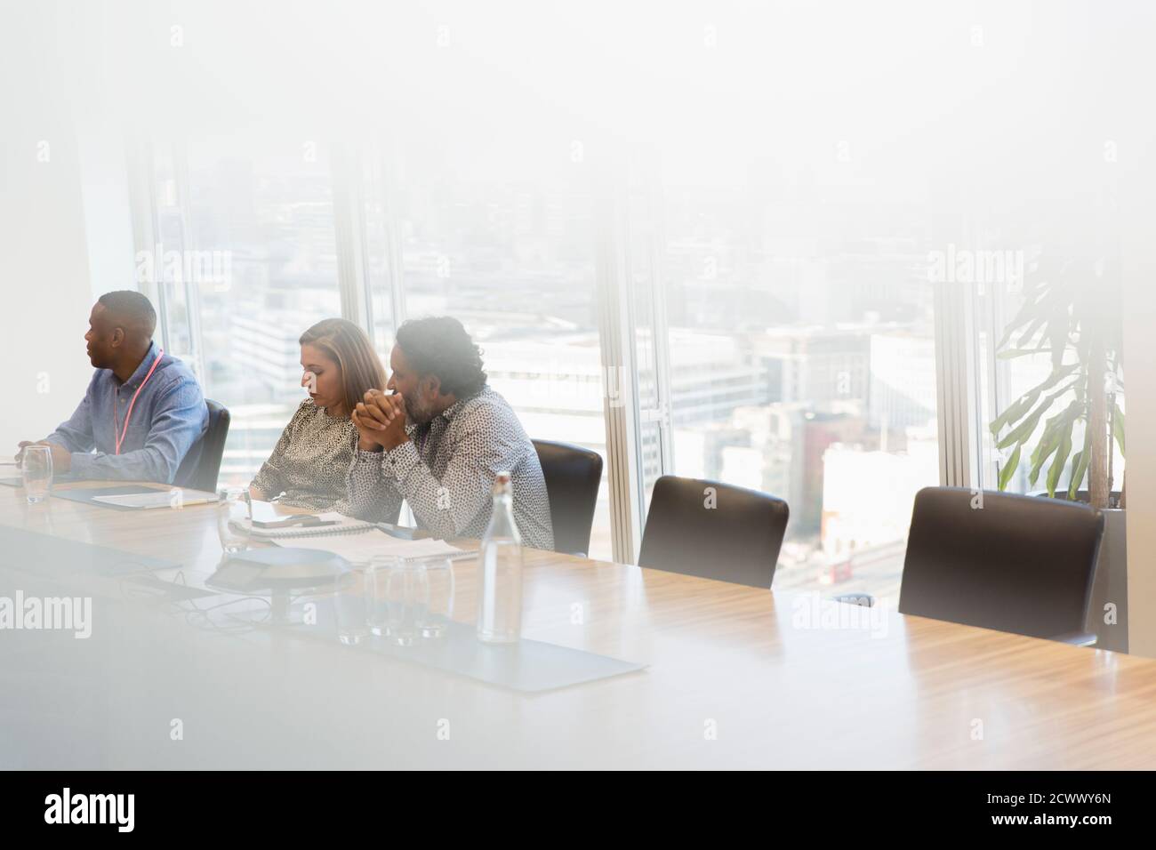 Business people listening in conference room meeting Stock Photo