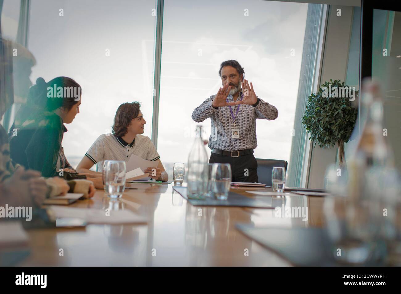 Businessman leading conference room meeting Stock Photo Alamy