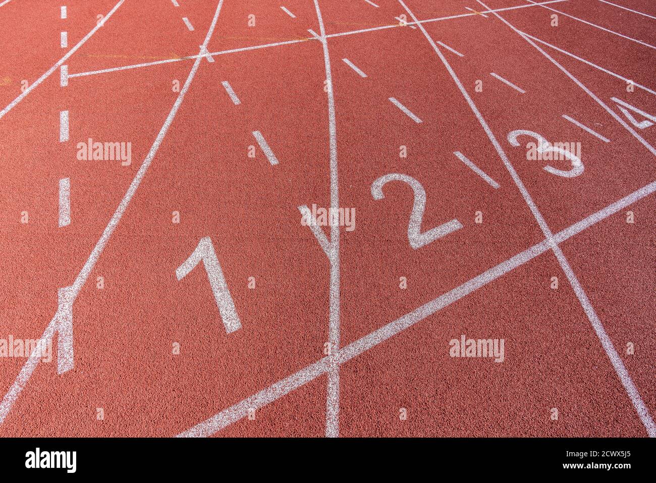 White painted lines and numbers on a running track in a athleticism and sports field. . High quality photo Stock Photo