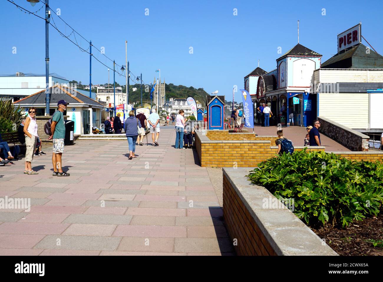 Teignmouth, Devon, UK. September 17, 2020.  Tourists and holidaymakers enjoying the promenade in front of the pier at Teignmouth in Devon, UK. Stock Photo