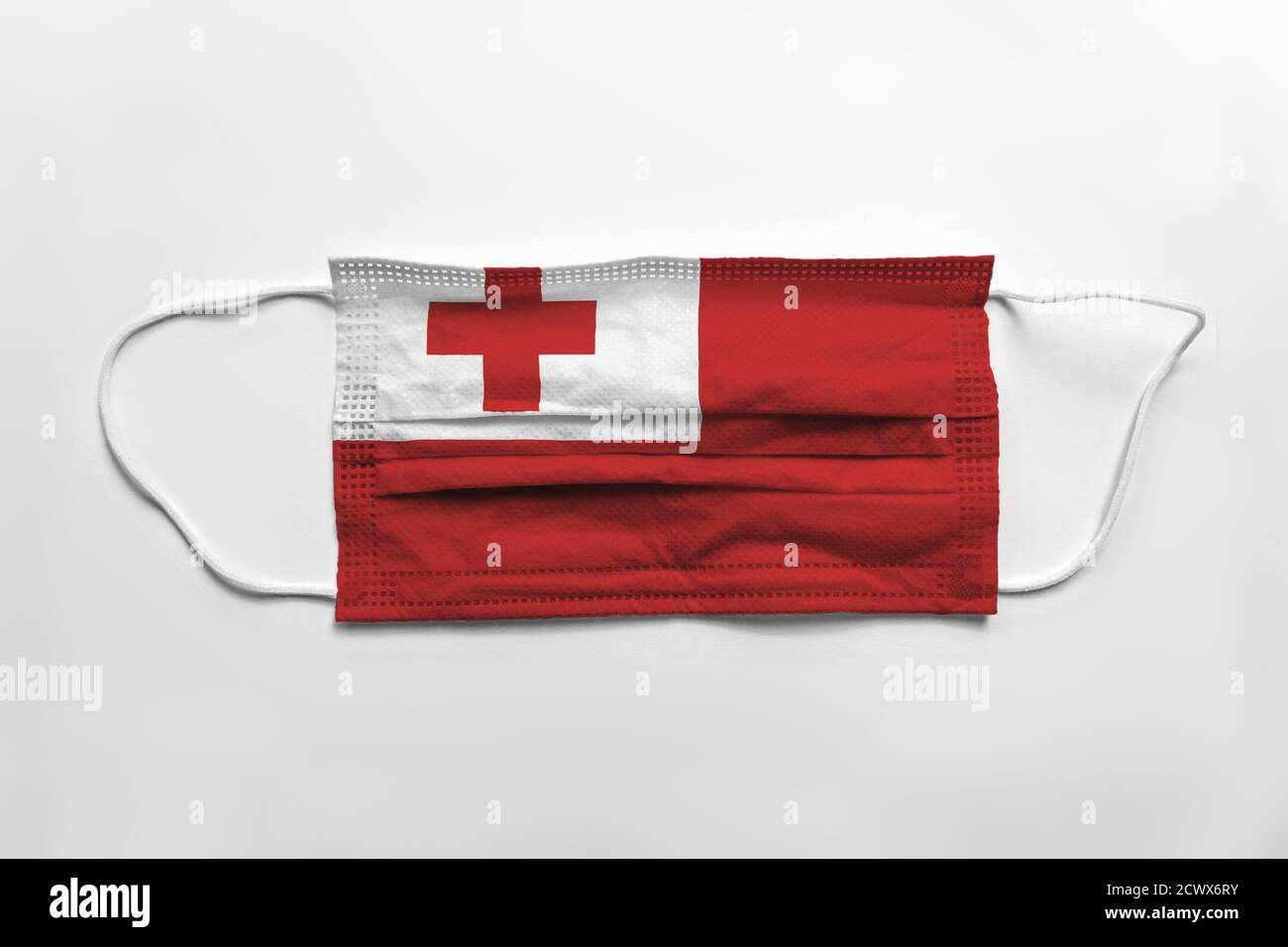 Face mask with Tonga flag printed, on white background, isolated Stock